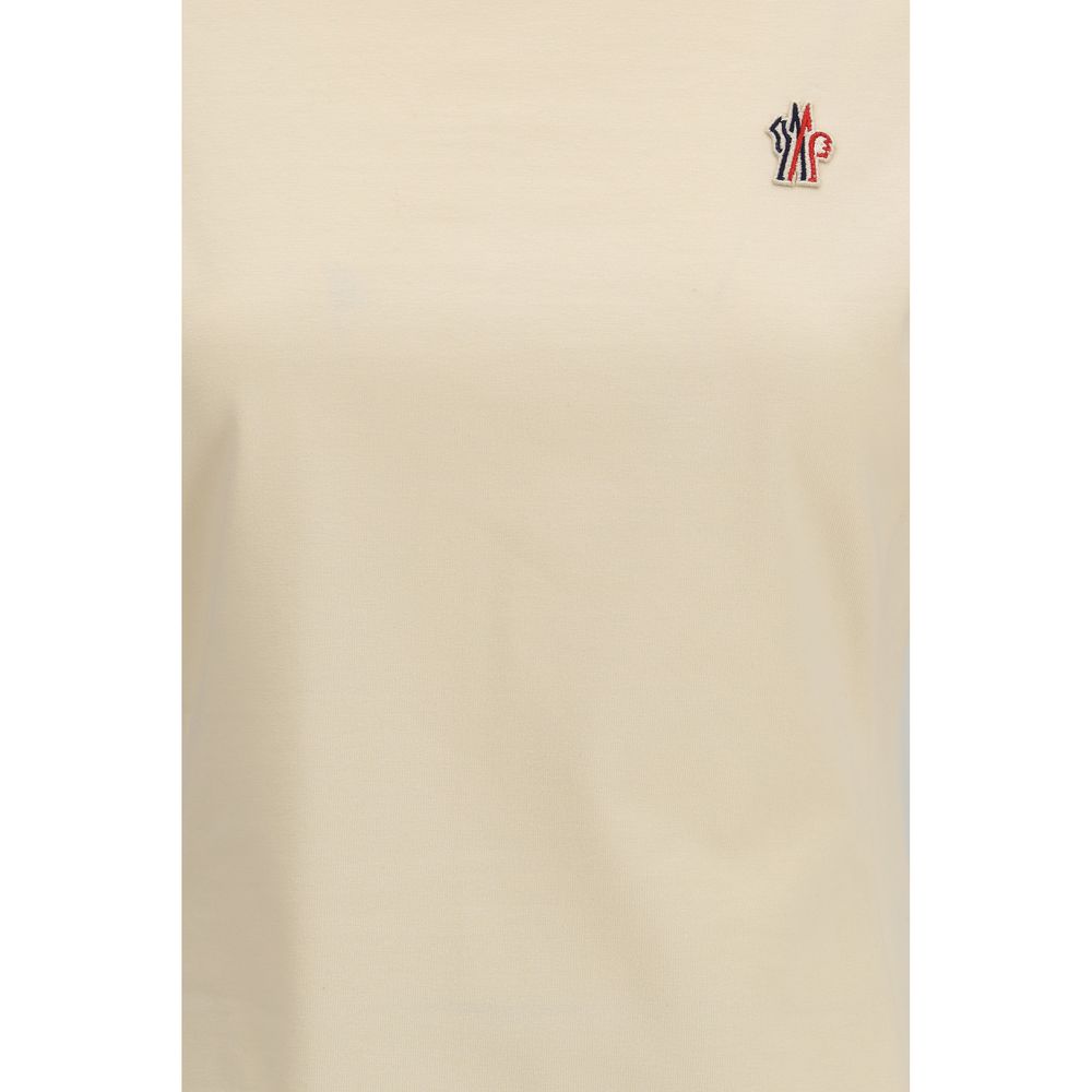 Experience the allure of the Moncler Grenoble Beige Cotton T-Shirt, a luxurious essential crafted from superior cotton, blending elegance and comfort for every occasion.