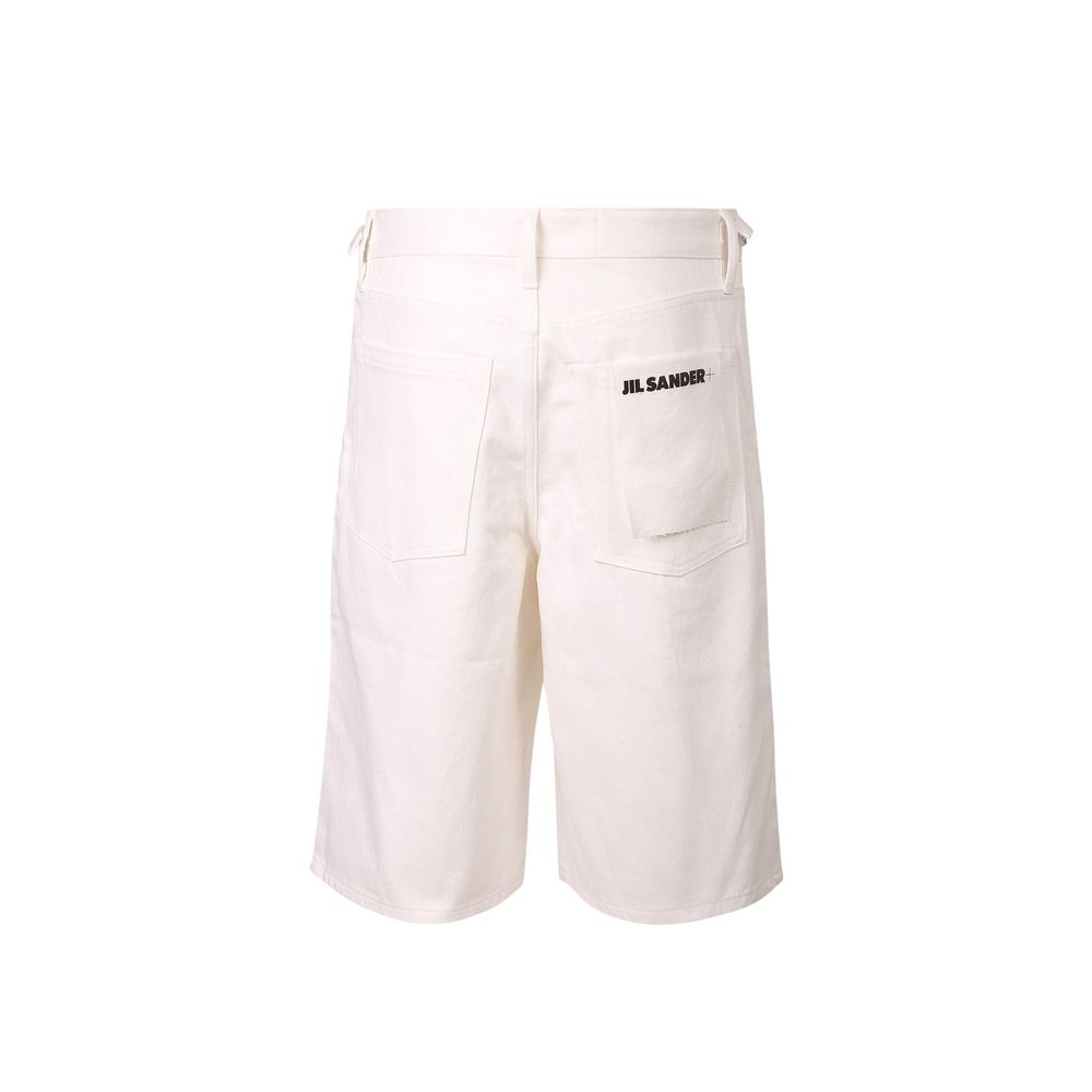 Elevate your wardrobe with the Jil Sander White Cotton Knee Length, a masterpiece of luxurious cotton that embodies timeless elegance and sophisticated style for discerning individuals.