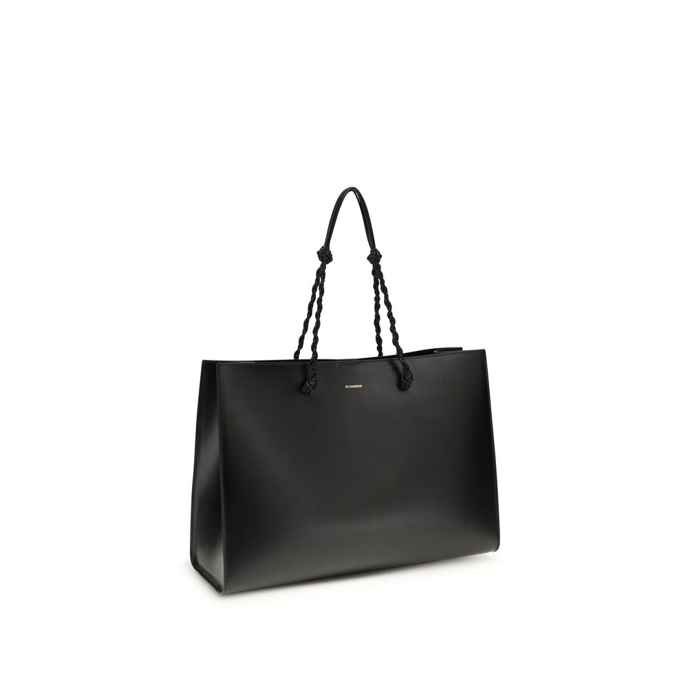 Discover the Jil Sander Black Calf Leather Bos Taurus Shoulder Bag, a masterpiece of minimalist luxury and exquisite craftsmanship, perfect for the discerning connoisseur.
