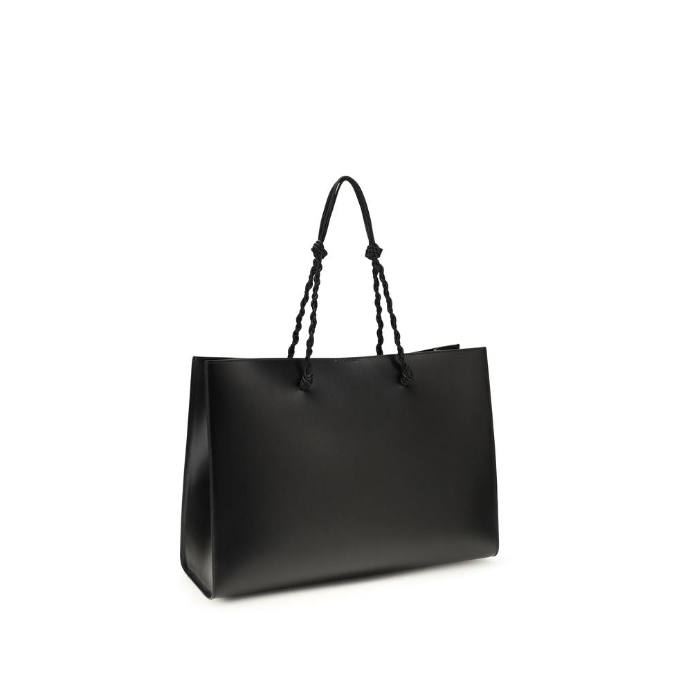 Discover the Jil Sander Black Calf Leather Bos Taurus Shoulder Bag, a masterpiece of minimalist luxury, expertly crafted for those who embody elegance and sophistication.