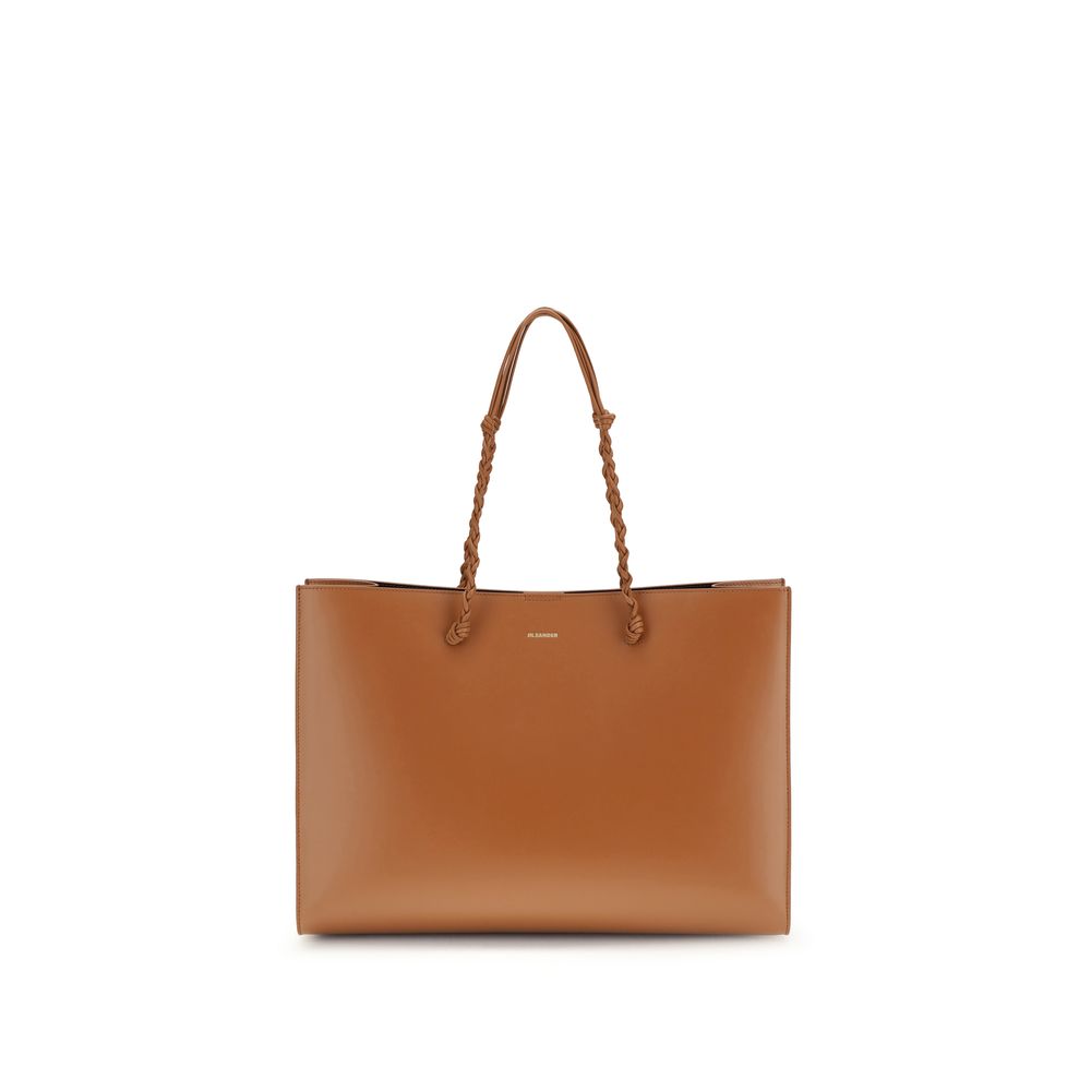 Indulge in the Jil Sander Brown Calf Leather Bos Taurus Shoulder Bag, a timeless blend of artisanal craftsmanship and luxurious design, perfect for the discerning individual.