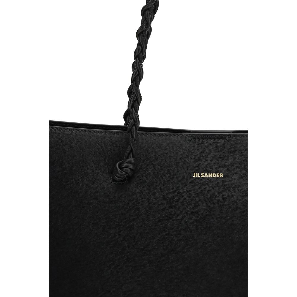 Elevate your style with the Jil Sander Black Calf Leather Bos Taurus Shoulder Bag, a masterpiece of minimalist luxury and exquisite craftsmanship for discerning tastes.