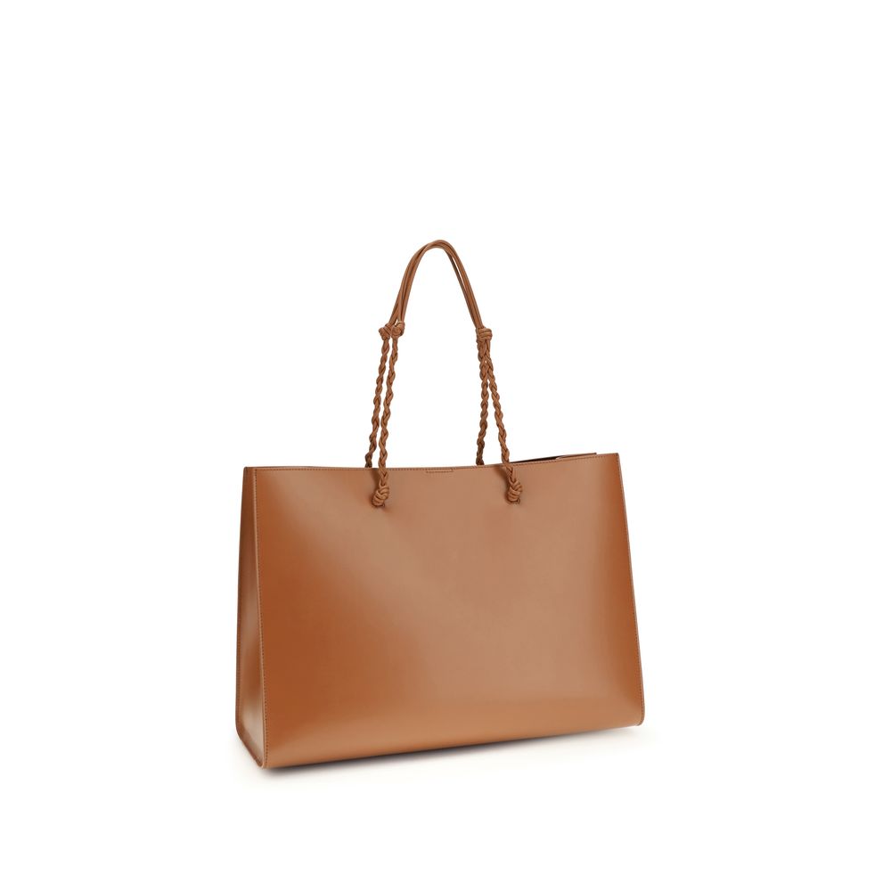 Discover the Jil Sander Brown Calf Leather Bos Taurus Shoulder Bag, an exquisite blend of luxury craftsmanship and timeless elegance, perfect for any sophisticated wardrobe.