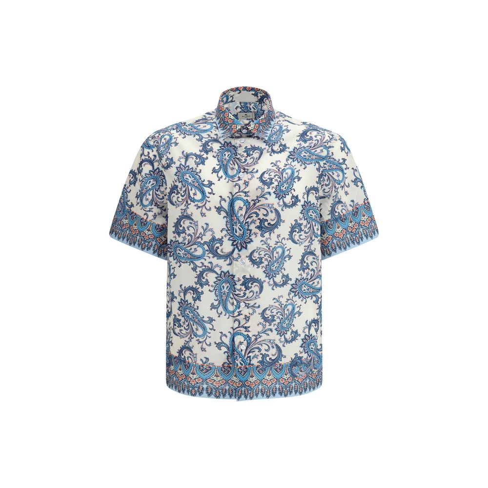 Elevate your wardrobe with the Etro Blue Cotton Pattern Shirt, a luxurious blend of floral and paisley motifs crafted from lightweight cotton, perfect for any occasion.