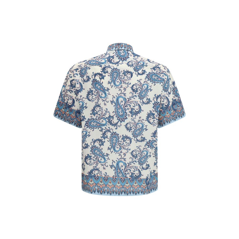 Elevate your wardrobe with the Etro Blue Cotton Pattern Shirt, a luxurious blend of floral elegance and modern sophistication, perfect for any discerning connoisseur.