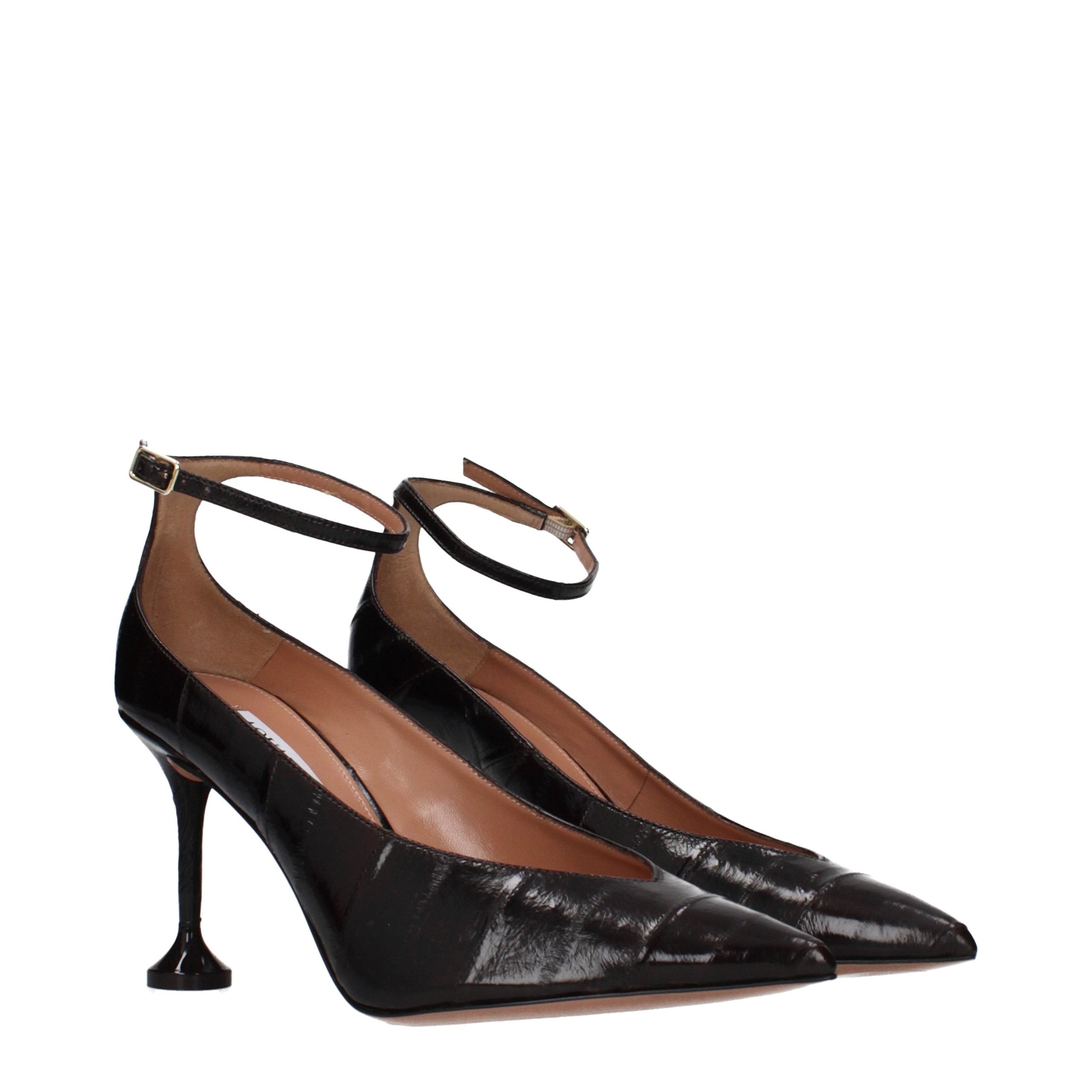 Elevate your elegance with Aquazzura's Brown Leather High Heel Pumps, where exquisite craftsmanship meets timeless luxury for the discerning individual.