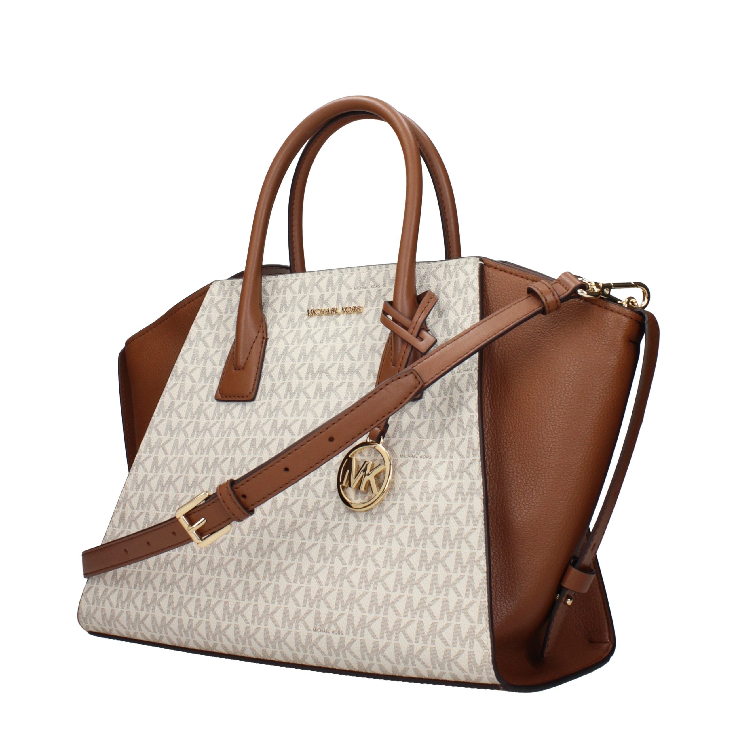 Indulge in the exquisite Michael Kors Beige Fabric Handbag, a timeless accessory that embodies luxury and sophistication, perfect for any occasion.