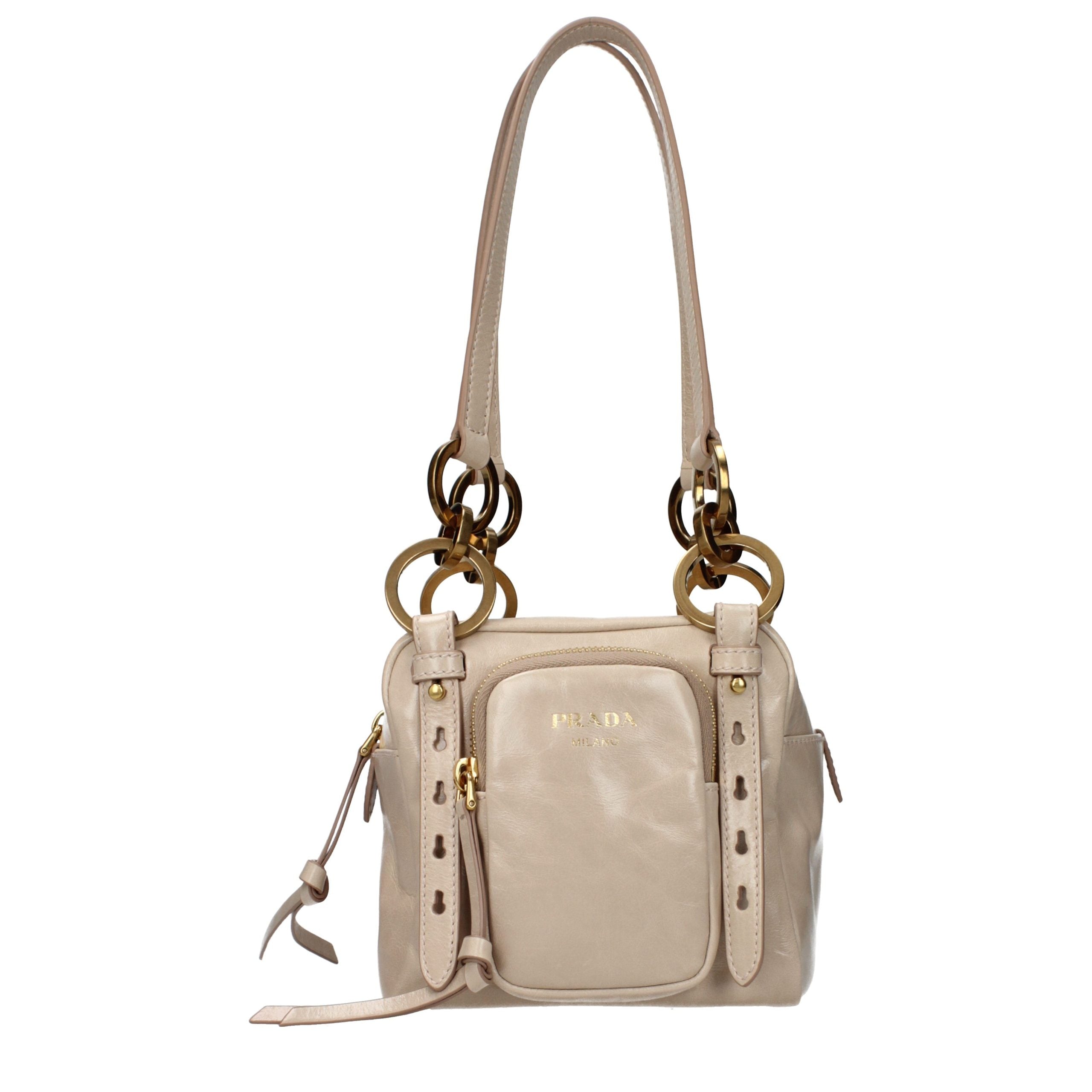 Indulge in the exquisite Prada Pink Leather Shoulder Bag, a symbol of luxury and craftsmanship that elevates any ensemble with its timeless elegance.