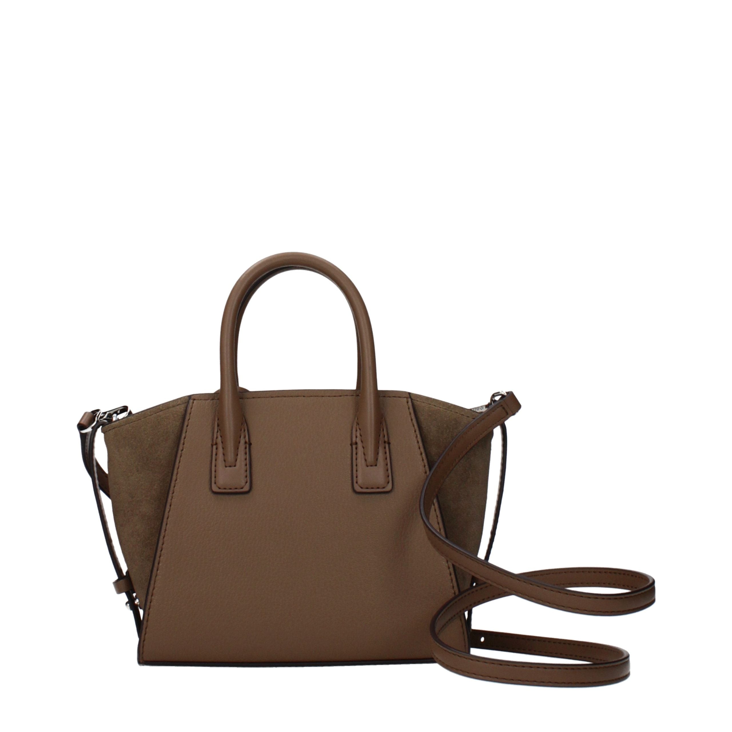 Discover the Michael Kors Brown Leather Handbag, a masterpiece of artisanal luxury, crafted from exquisite leather for the discerning individual seeking timeless elegance.
