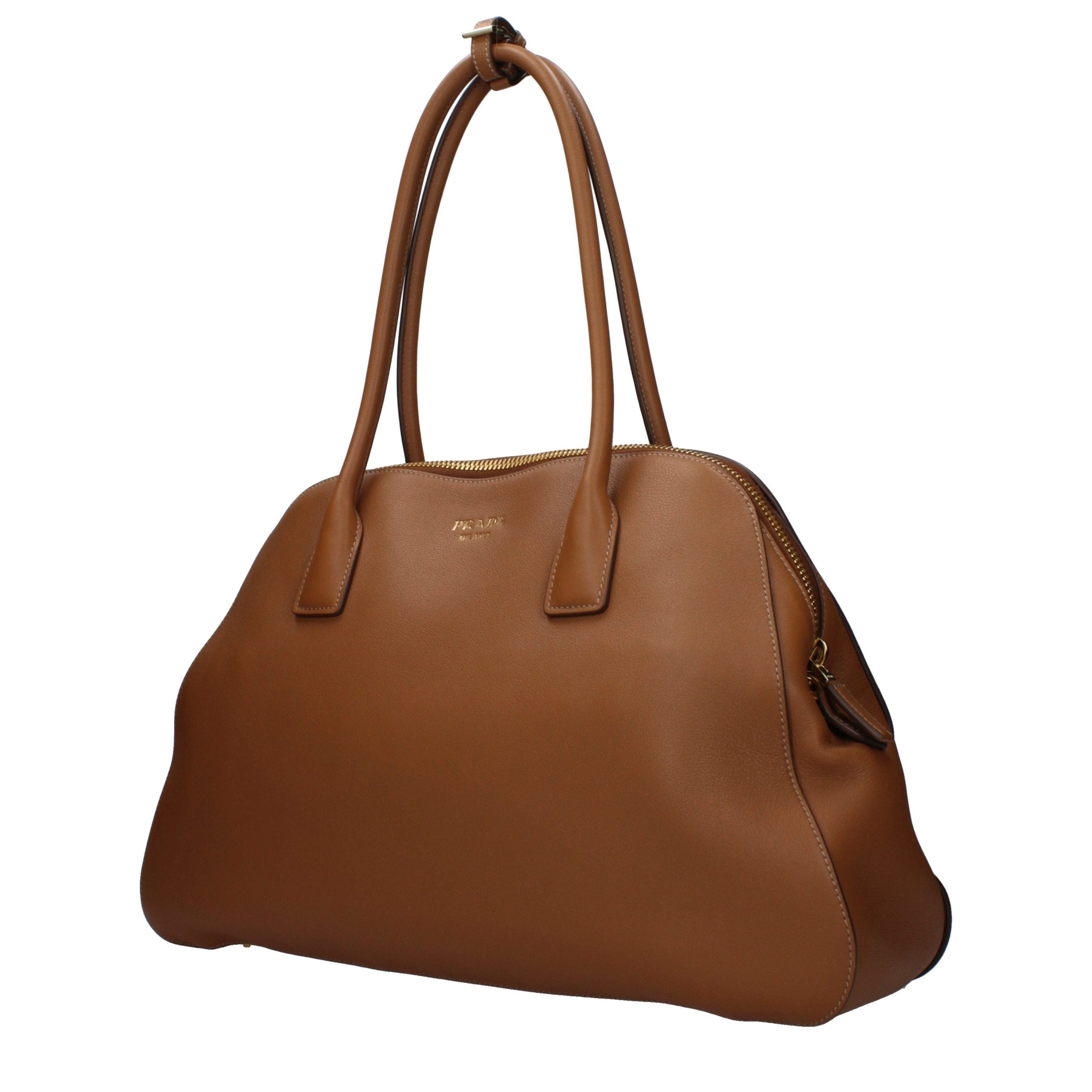 Discover the Prada Brown Leather Shoulder Bag, a symbol of artisanal luxury and sophistication, crafted for those who embrace elegance and timeless style.