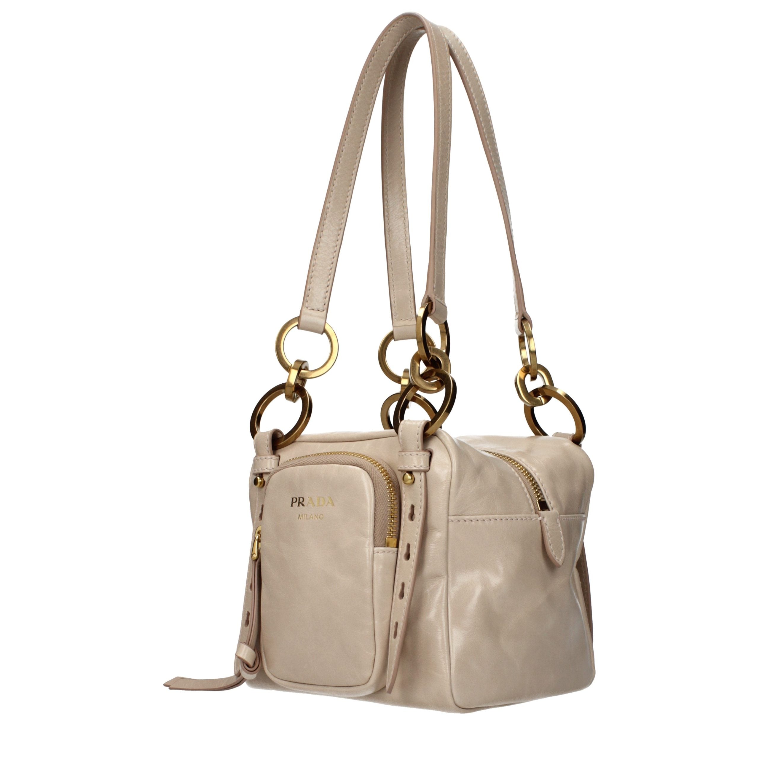 Indulge in the exquisite Prada Pink Leather Shoulder Bag, a timeless accessory that embodies luxury and sophistication, perfect for elevating any ensemble.