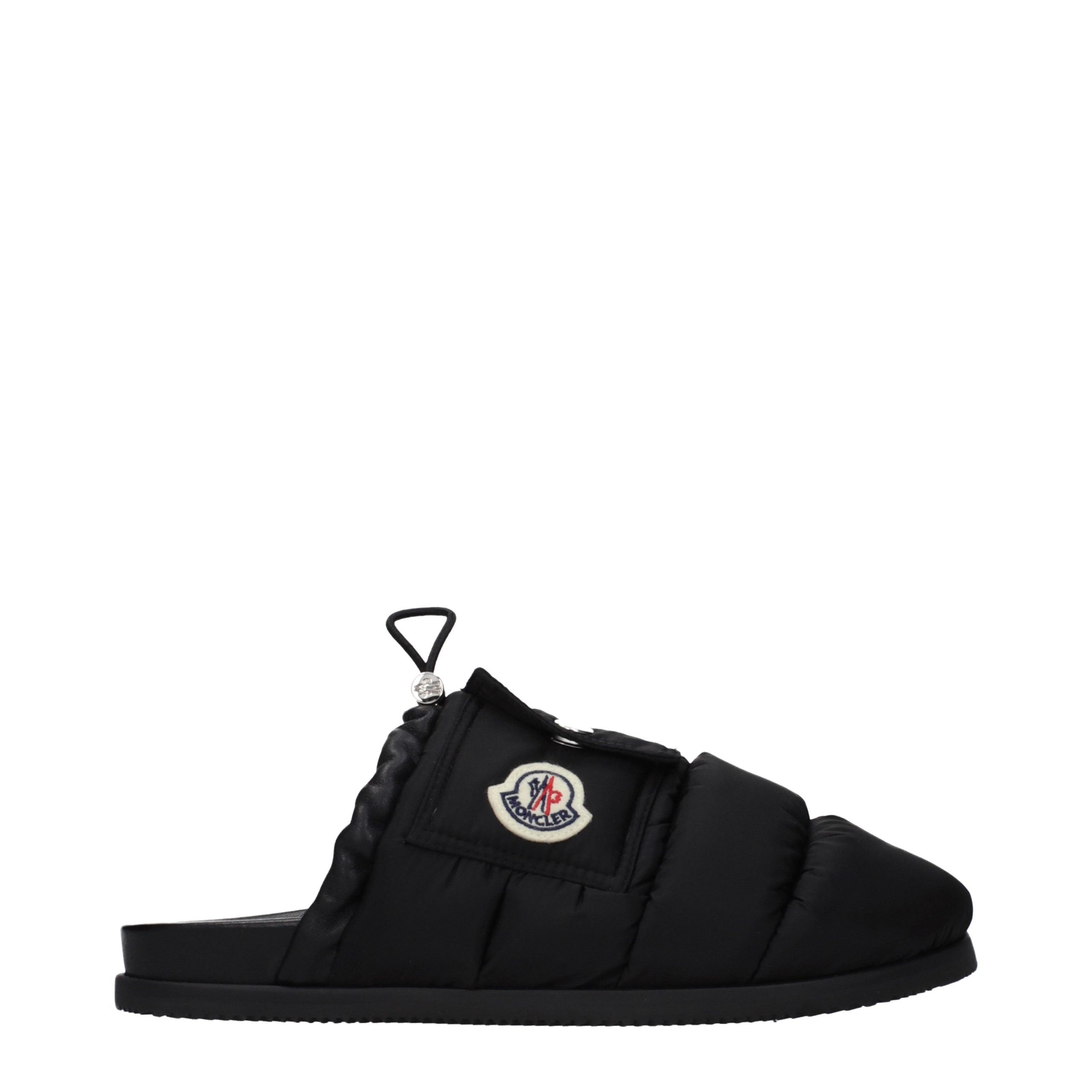 Indulge in the Moncler Black Fabric Slippers, where luxury meets comfort, crafted for the discerning individual who appreciates elegance and sophistication.