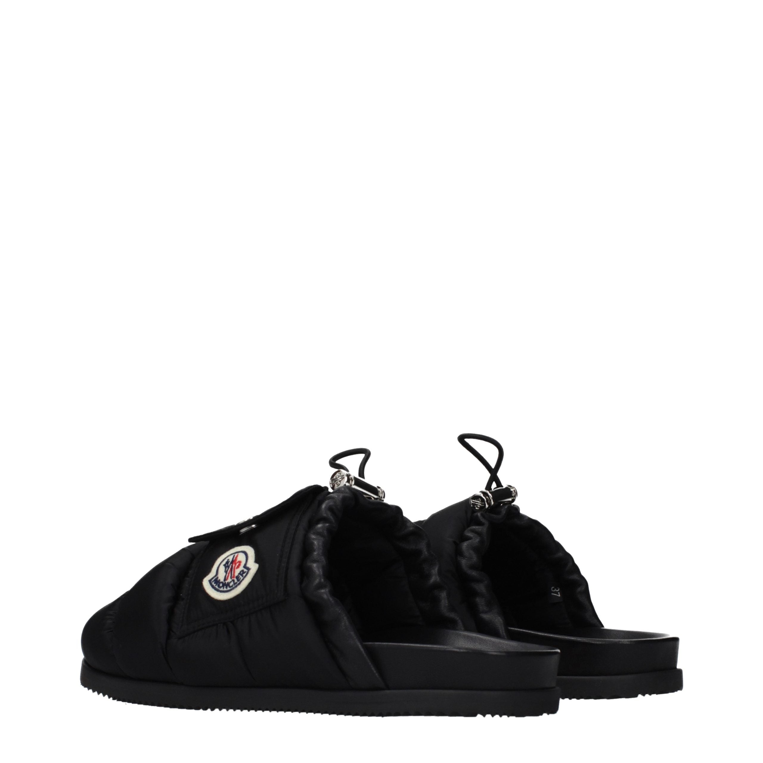Indulge in Moncler Black Fabric Slippers, where exquisite craftsmanship meets luxurious comfort, perfect for those who embody elegance and sophistication.
