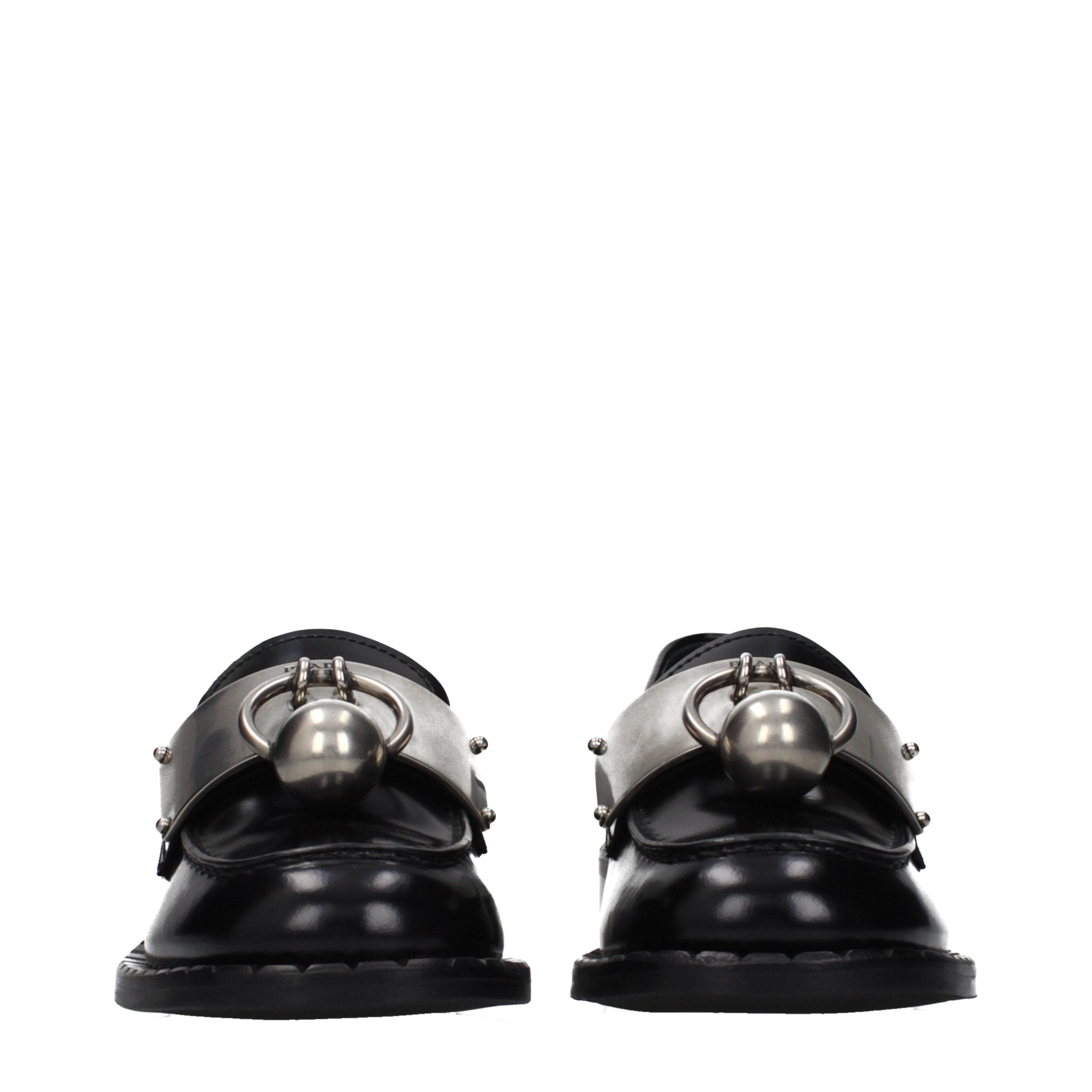 Experience the pinnacle of luxury with Prada Black Leather Slip-On Loafers, where exquisite craftsmanship meets timeless elegance for the discerning individual.