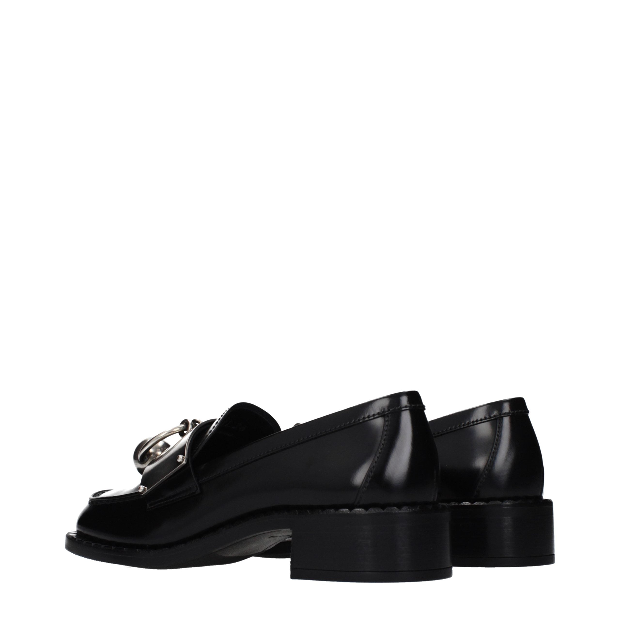 Experience the allure of Prada Black Leather Slip-On Loafers, where exquisite craftsmanship meets timeless elegance, perfect for the discerning individual.
