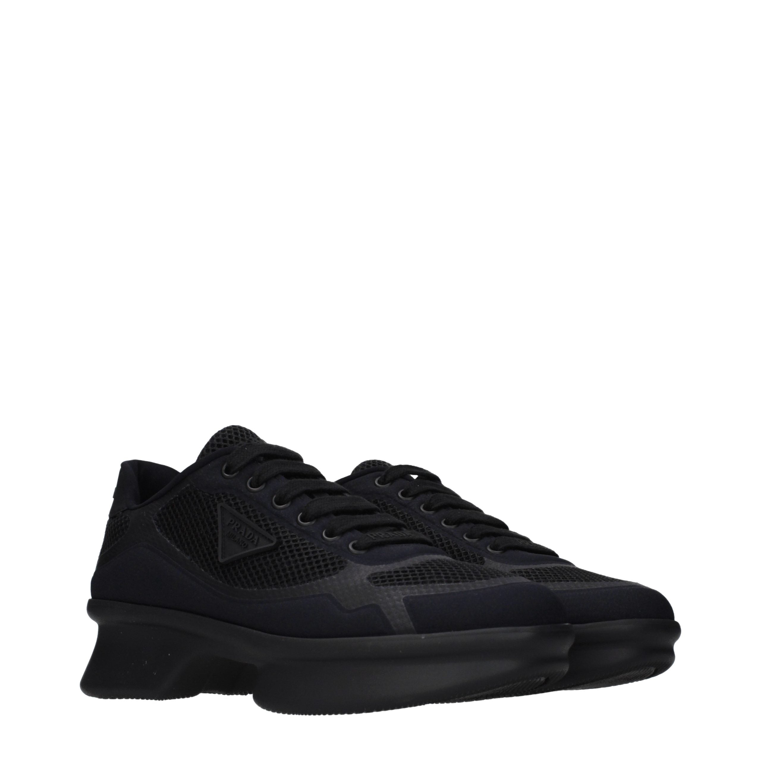 Experience the allure of Prada Black Fabric Low Top Sneakers, where exquisite craftsmanship meets timeless elegance, perfect for the discerning individual.