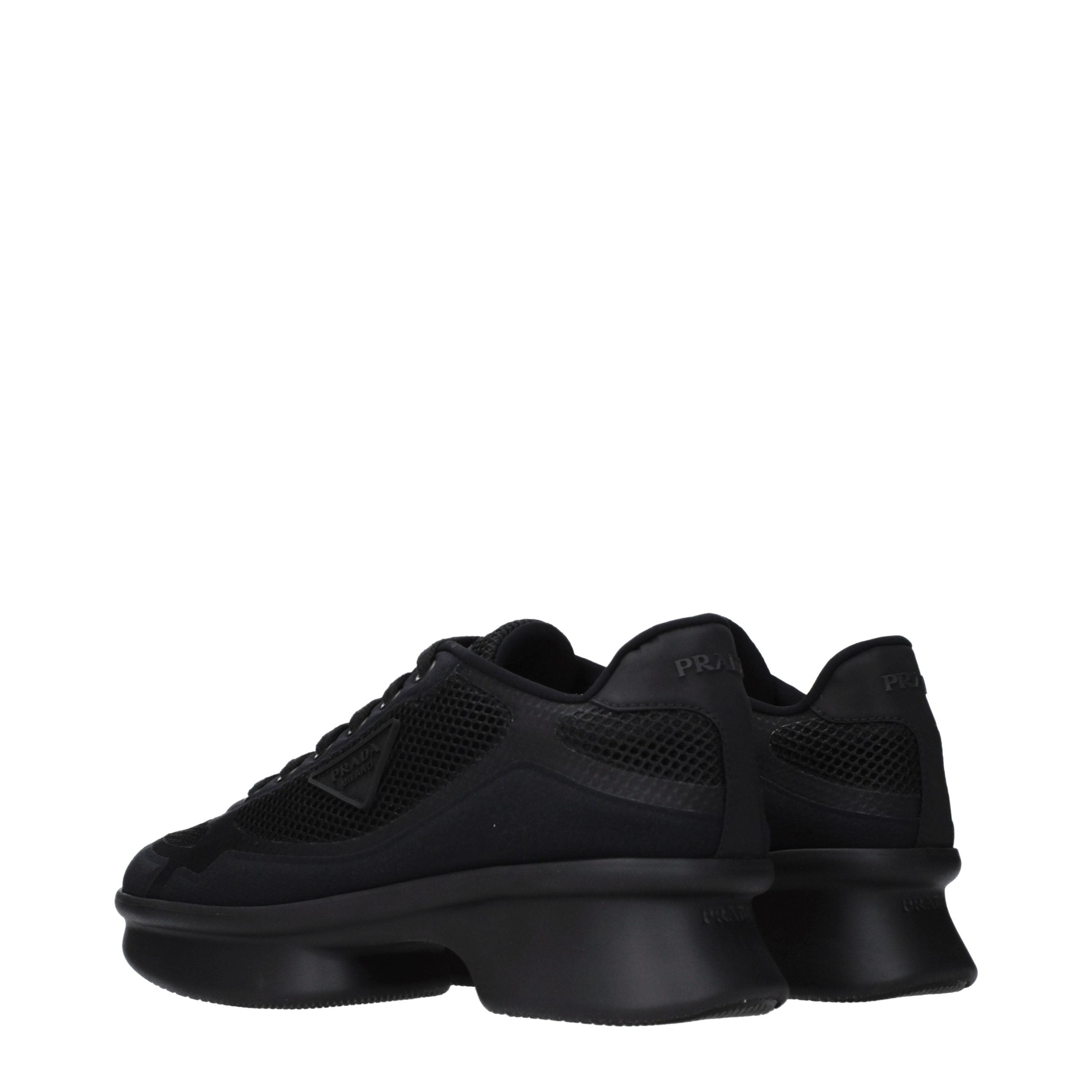 Elevate your style with Prada Black Fabric Low Top Sneakers, where exquisite craftsmanship meets timeless elegance, perfect for the discerning individual seeking luxury.
