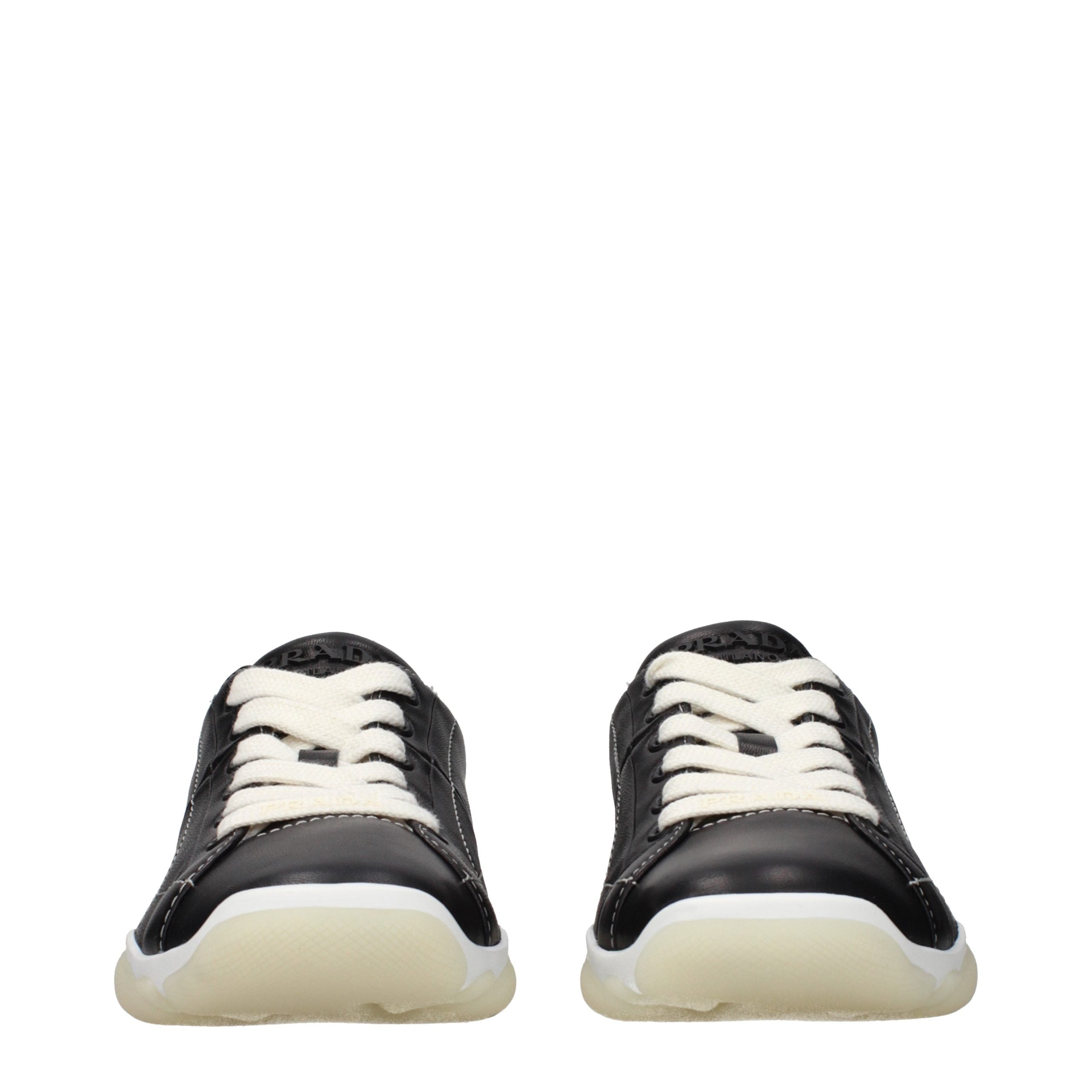 Experience the allure of Prada's Black Leather Sneakers, where timeless craftsmanship meets modern elegance, elevating your style to unparalleled heights.