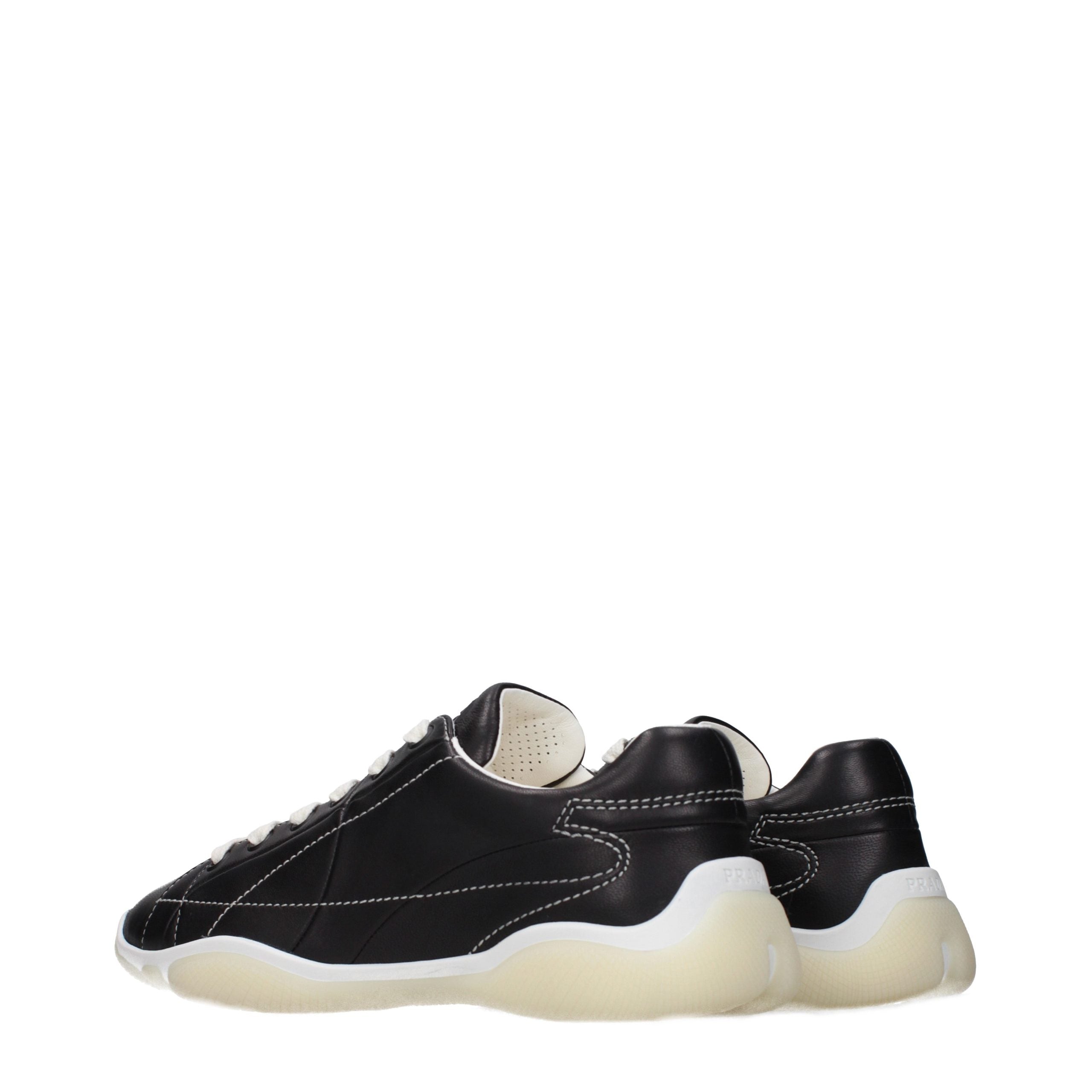 Experience the exquisite allure of Prada's Black Leather Sneakers, where timeless craftsmanship meets contemporary elegance, elevating your style with luxurious sophistication.