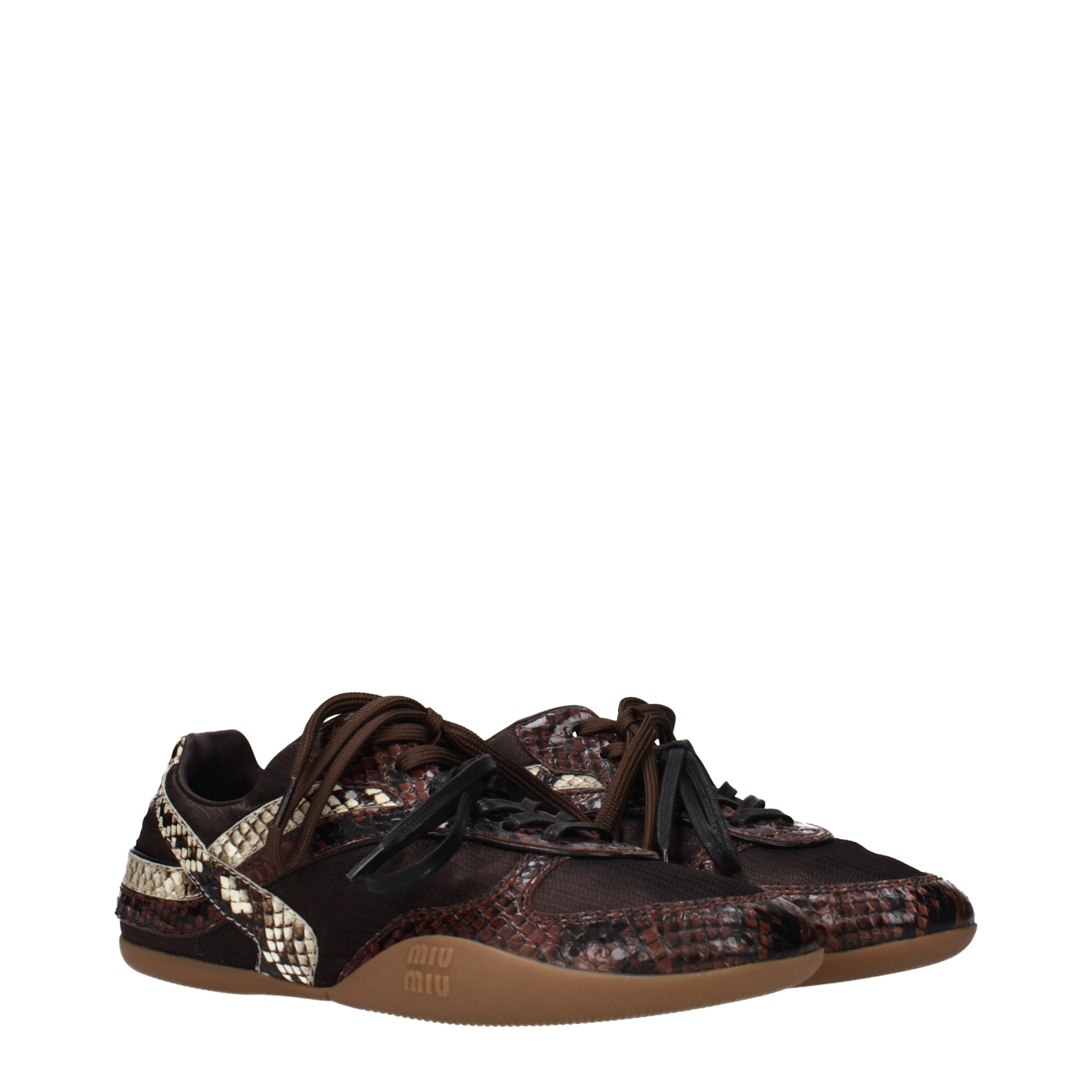 Indulge in the exquisite Miu Miu Brown Fabric Low Top Sneakers, where refined craftsmanship meets luxurious style, perfect for elevating any sophisticated ensemble.