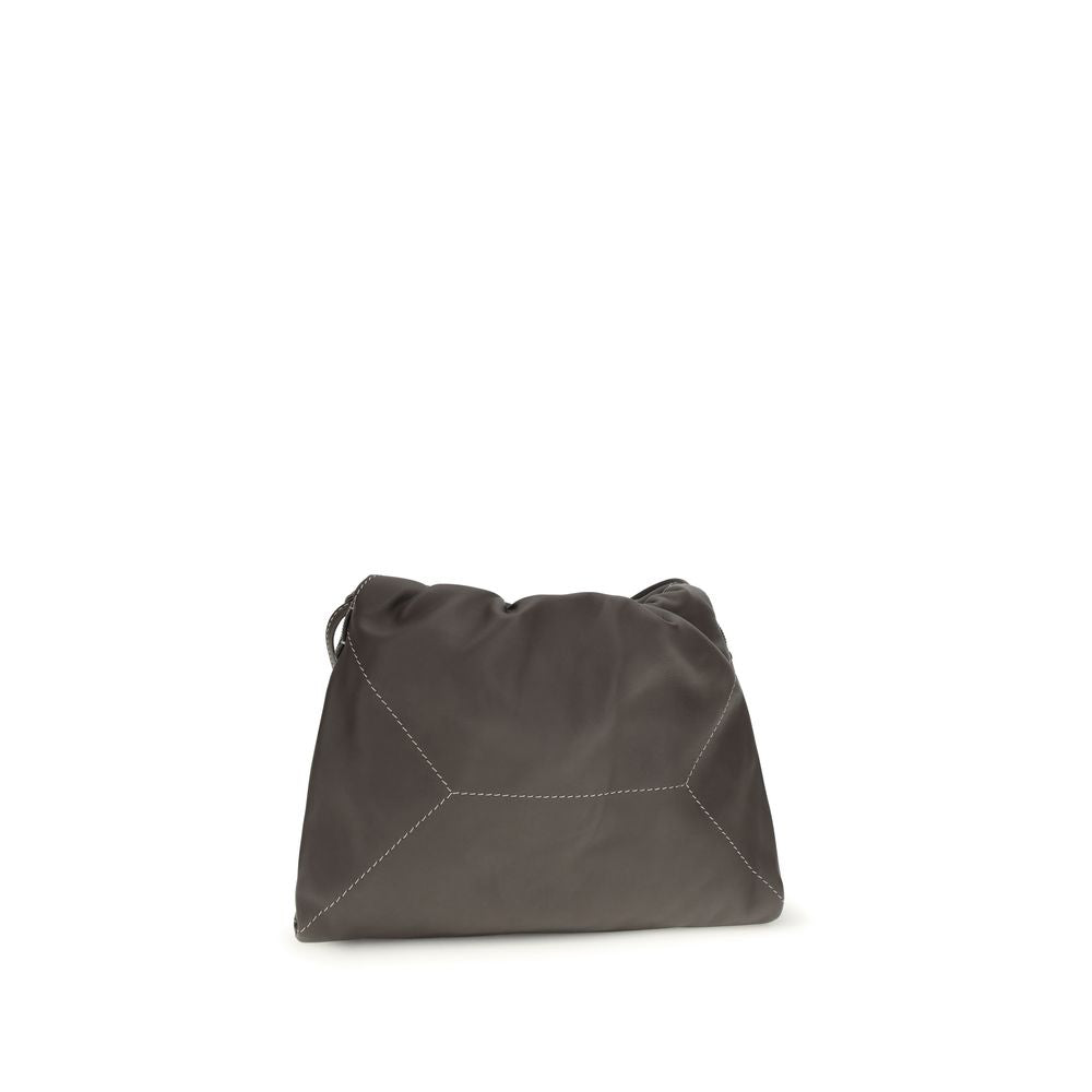 Discover the Brunello Cucinelli Brown Calf Leather Bos Taurus Shoulder Bag, a masterpiece of luxury craftsmanship that embodies timeless elegance and sophisticated allure.