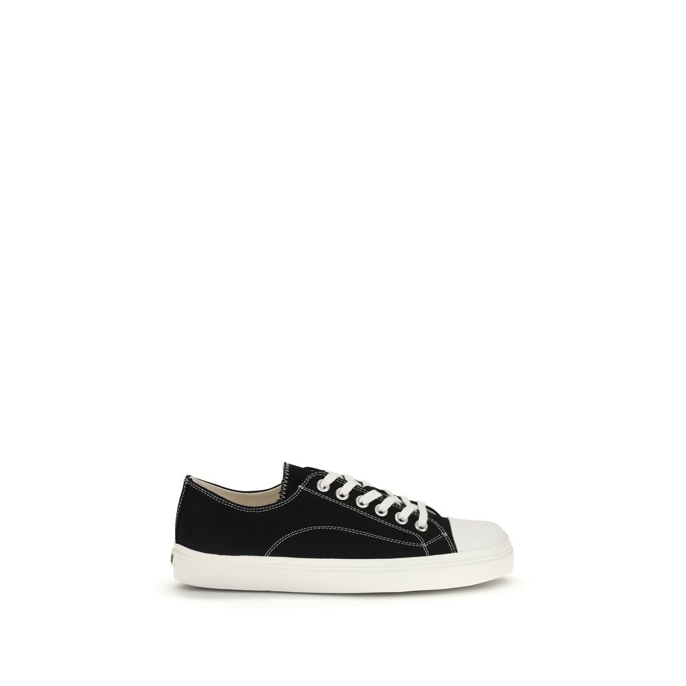 Step into sophistication with Moschino Black Cotton Low Top Sneakers, where luxurious craftsmanship meets modern elegance for a timeless, chic look.