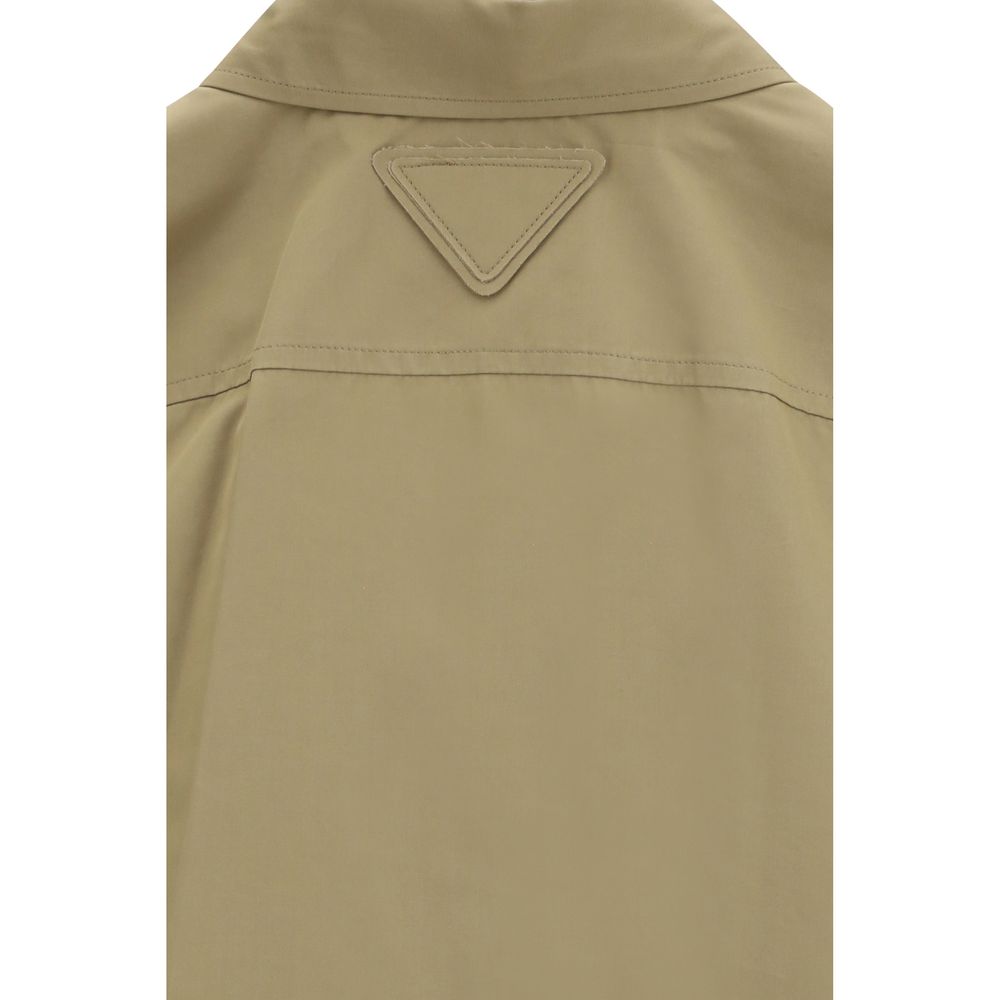 Discover the Prada Beige Cotton Shirt, a masterpiece of tailored precision and utilitarian elegance, crafted from 100% cotton for the discerning fashion connoisseur.