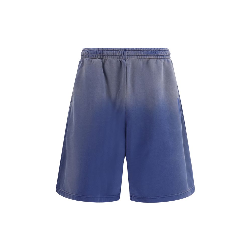 Elevate your wardrobe with Moschino Blue Cotton Bermuda Shorts, crafted from 100% premium cotton, embodying effortless elegance and luxurious comfort for the discerning individual.