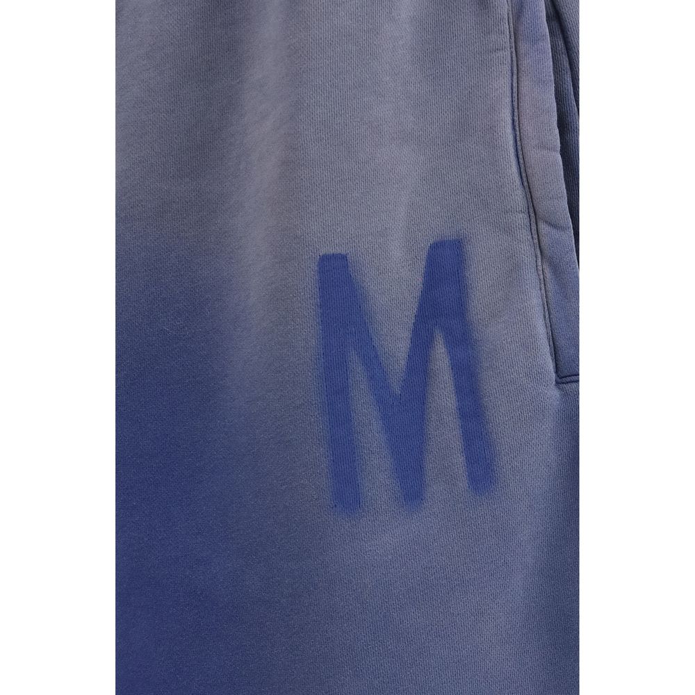 Elevate your wardrobe with the Moschino Blue Cotton Bermuda Shorts, a masterpiece of craftsmanship and luxury, designed for the discerning individual seeking effortless elegance.