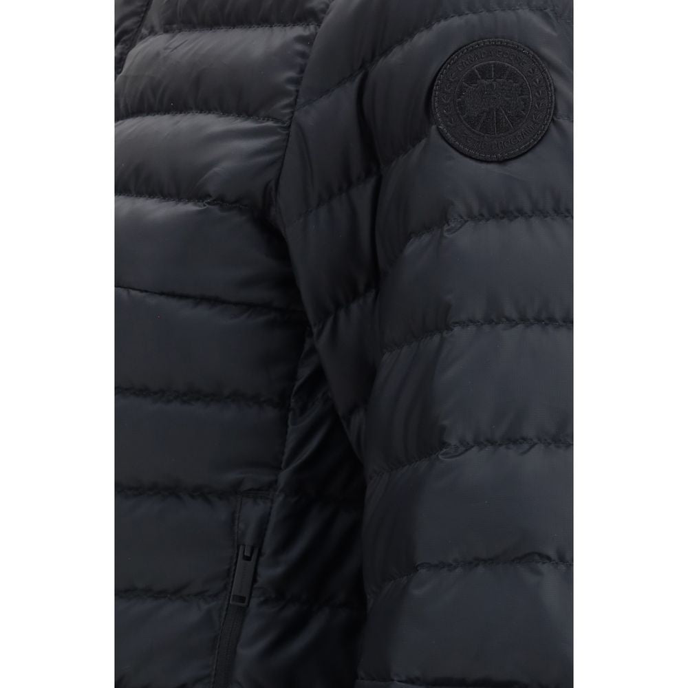 Discover the Canada Goose Black Recycled Polyester Shell Jacket, a fusion of sustainable luxury and sophisticated style, perfect for the modern adventurer.