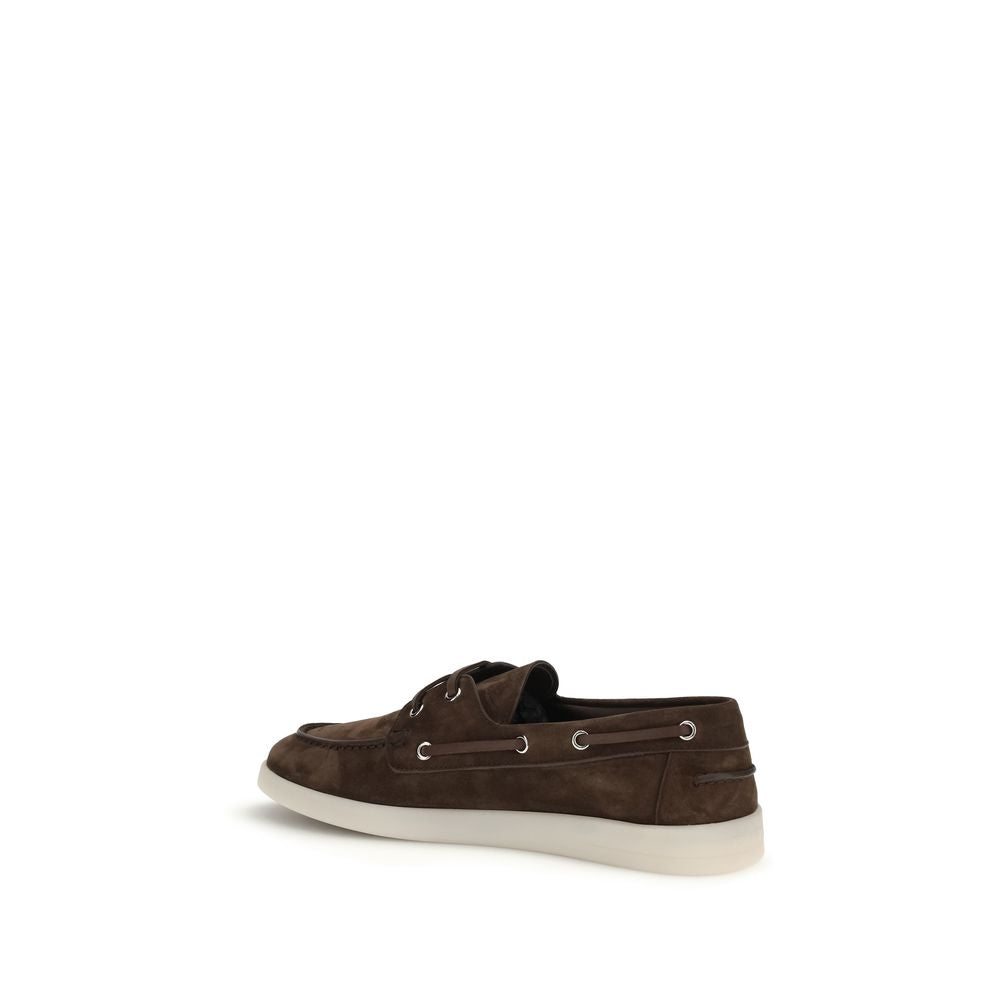Elevate your style with Prada Brown Calf Leather Bos Taurus Slip-On Loafers, where exquisite craftsmanship meets luxurious comfort for the discerning individual.