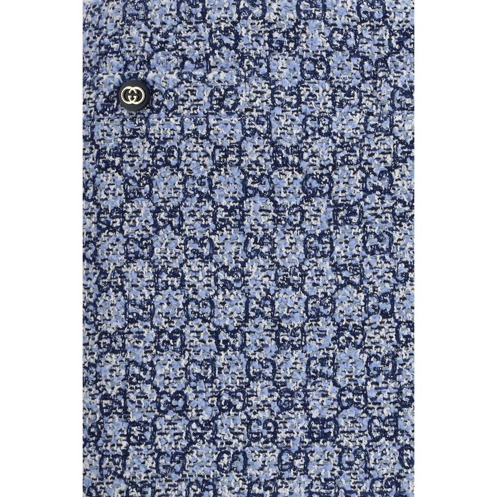 Elevate your wardrobe with the Gucci Blue Cotton Mini Skirt, a luxurious blend of GG tweed and exquisite craftsmanship, perfect for timeless sophistication.