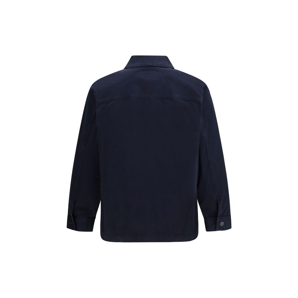 Indulge in the Saint Laurent Blue Cotton Denim Jacket, a masterpiece of structured elegance, crafted for those who embody sophistication and timeless allure.