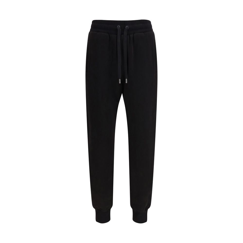 Indulge in the luxurious allure of Dolce & Gabbana's Black Cotton Casual Pants from the SS26 collection, where exquisite craftsmanship meets effortless elegance for the discerning individual.