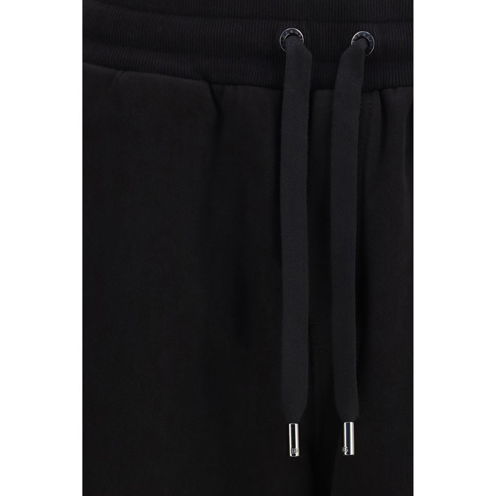 Indulge in the luxurious allure of Dolce & Gabbana's Black Cotton Casual Pants from the SS26 collection, where exquisite craftsmanship meets contemporary elegance for a sophisticated wardrobe essential.