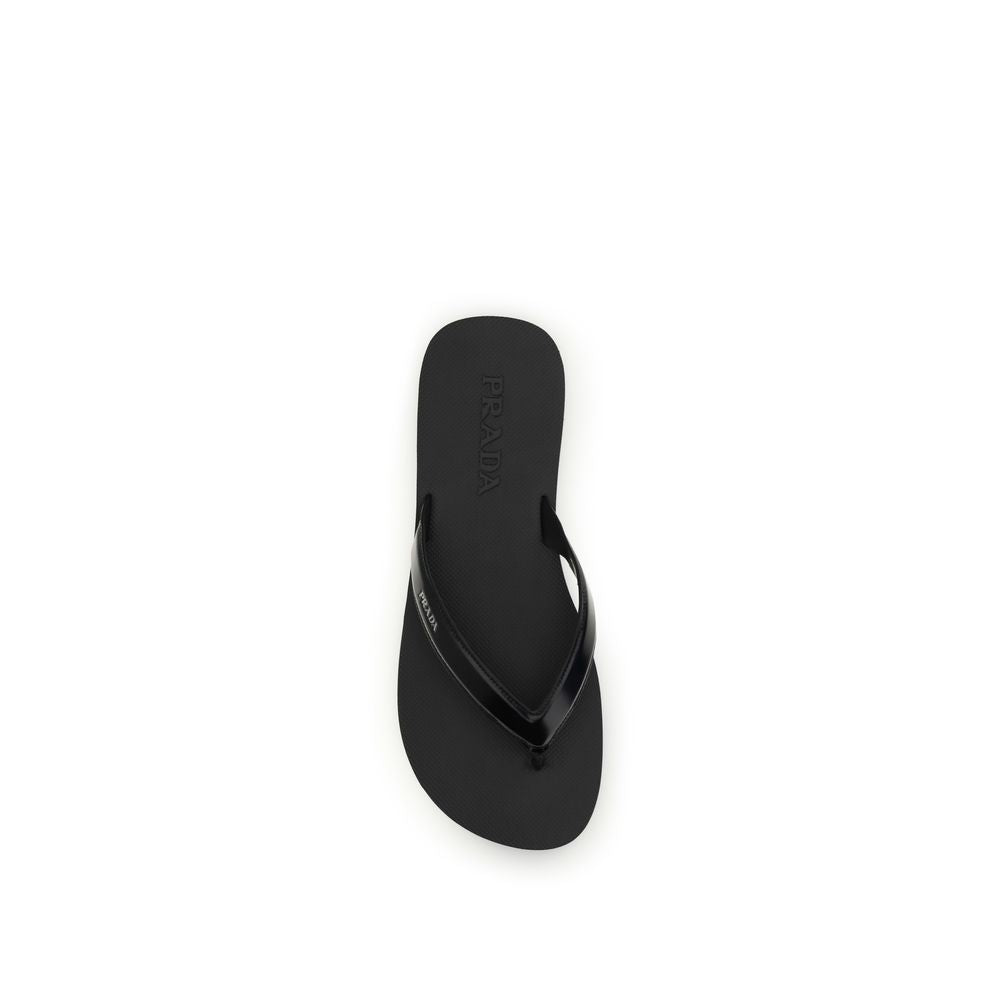 Experience the exquisite elegance of Prada's Black Calf Leather Bos Taurus Flip-Flop Sandals, where artisanal craftsmanship meets timeless luxury for discerning tastes.
