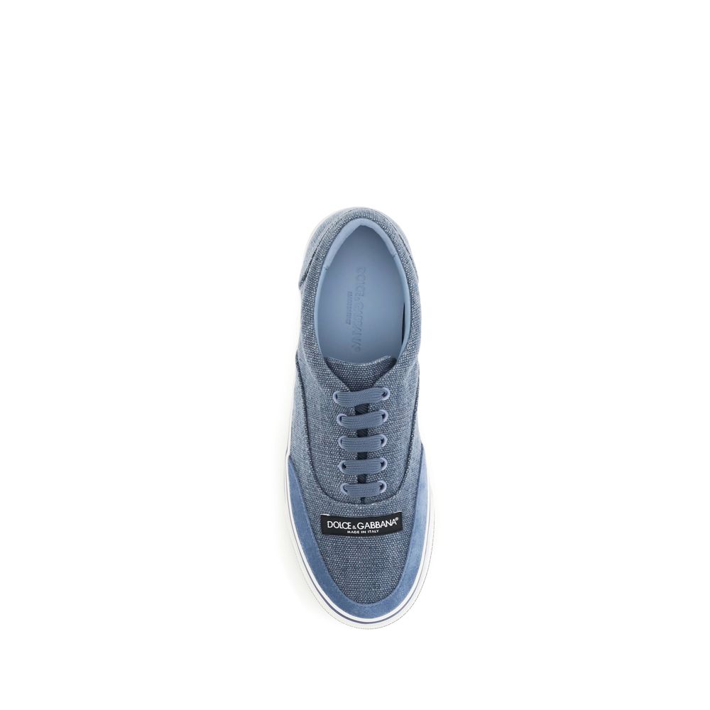 Discover the Dolce & Gabbana Blue Linen Low Top Sneakers, a fusion of luxurious craftsmanship and contemporary elegance, perfect for the discerning individual.
