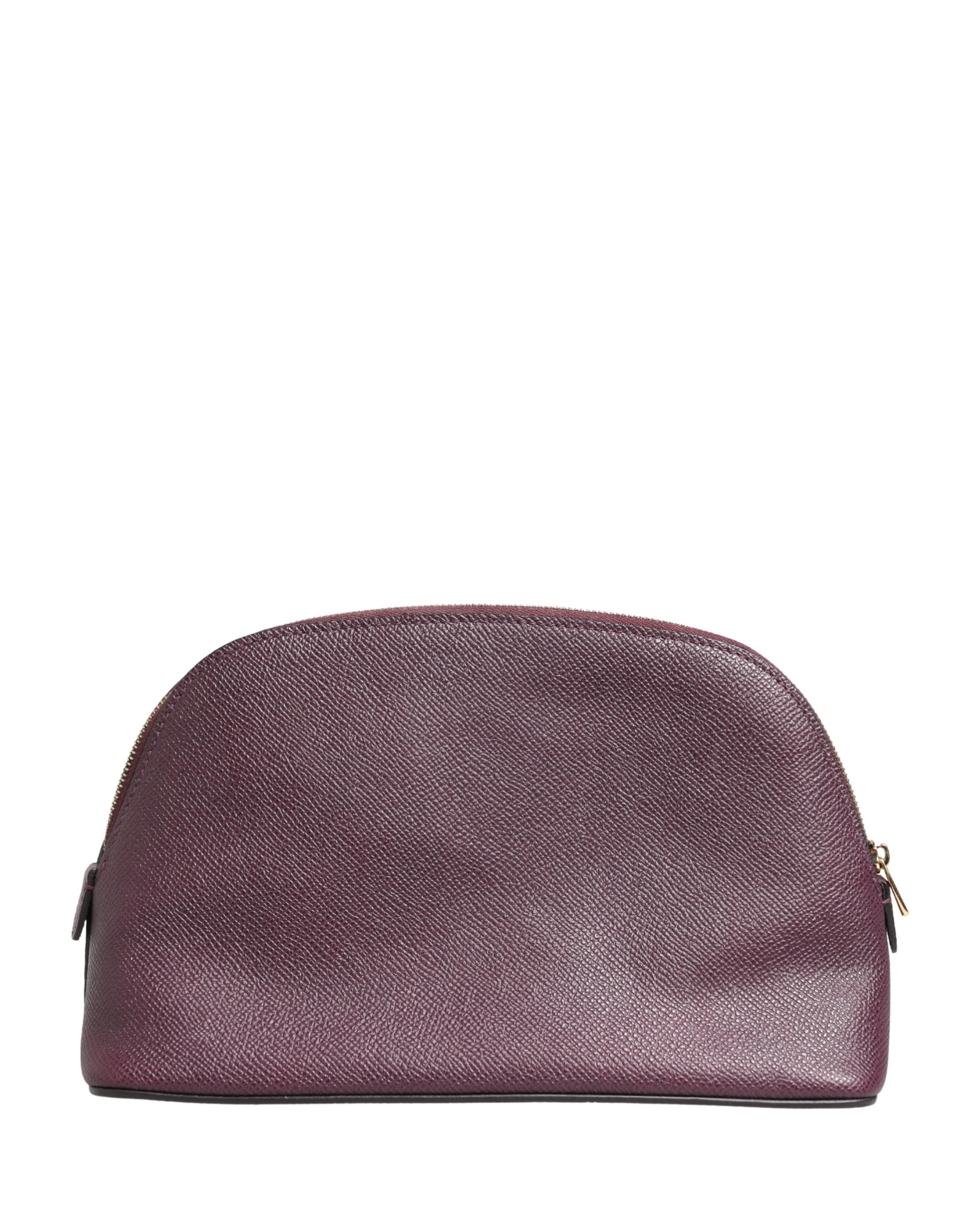 Discover the exquisite Dolce & Gabbana Dark Purple Leather DG Logo Zip Around Hand Purse Wallet, a timeless embodiment of Italian luxury and craftsmanship.