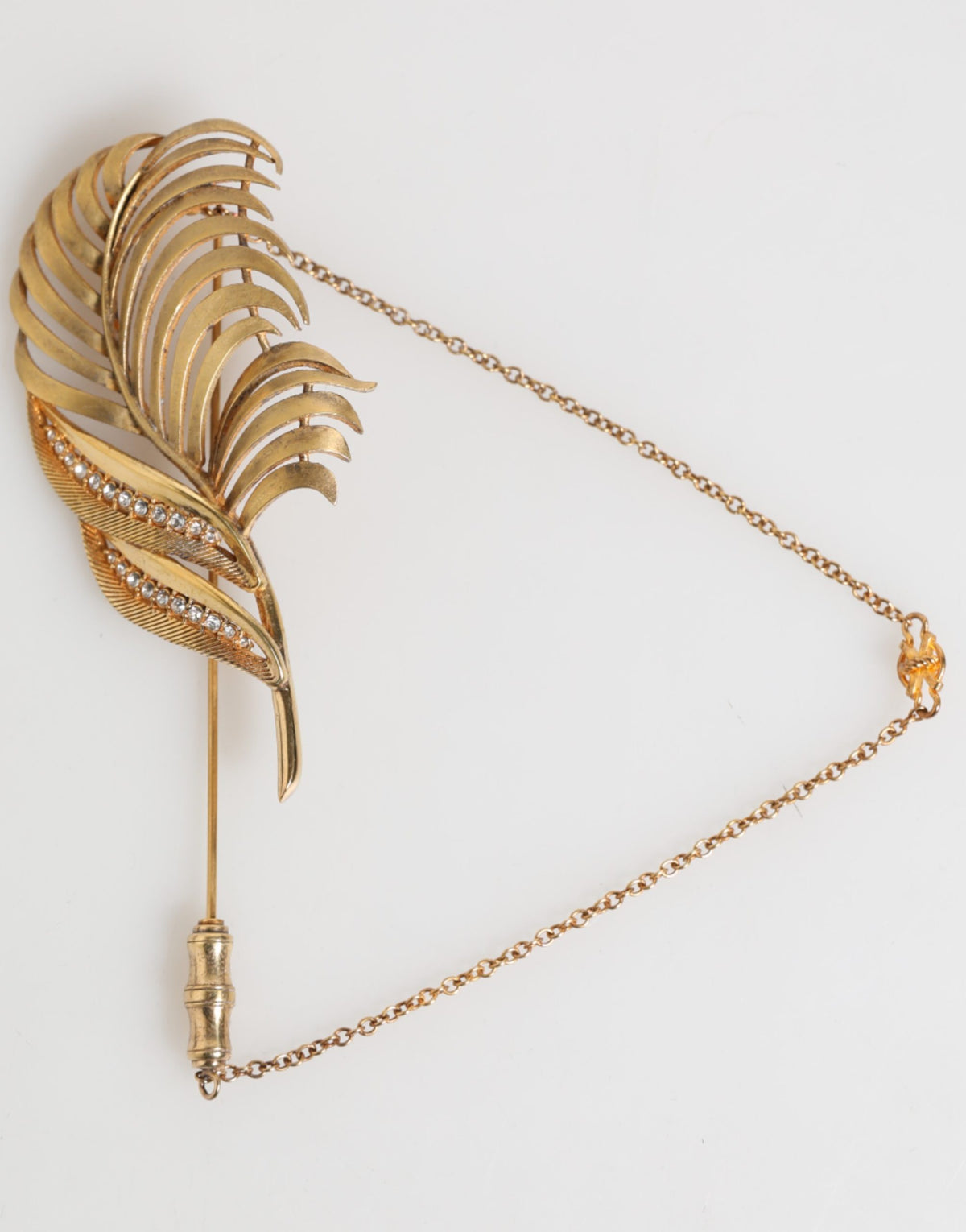 Discover the exquisite Dolce & Gabbana Gold Sterling Silver925 Leaf Embellished Lapel Pin Brooch, a masterful blend of luxury and artistry that elevates any ensemble.
