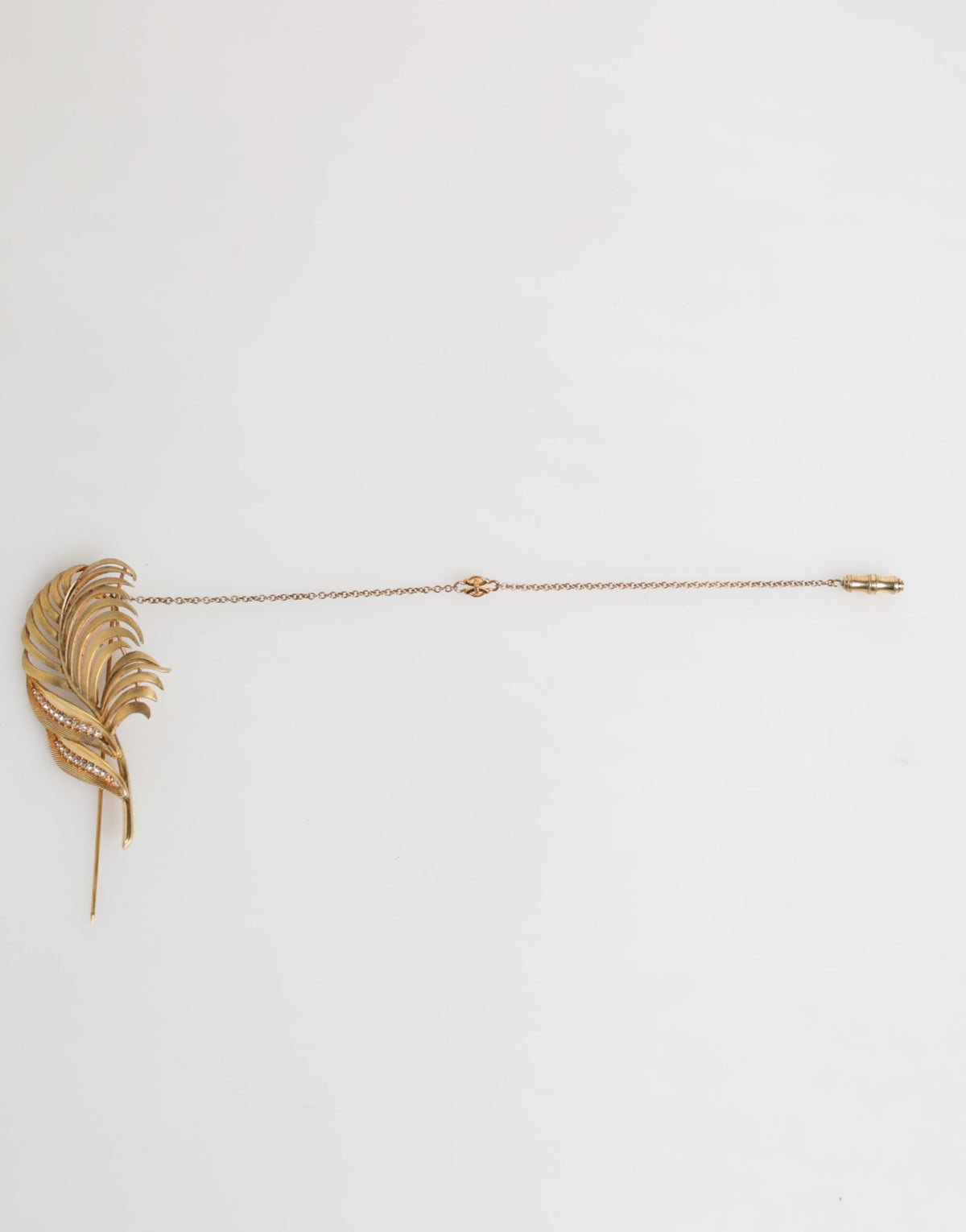 Discover the exquisite Dolce & Gabbana Gold Sterling Silver925 Leaf Embellished Lapel Pin Brooch, a luxurious statement piece that embodies elegance and artistry.