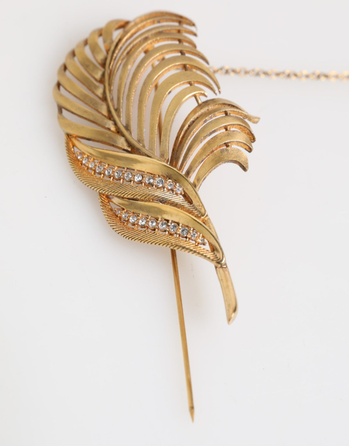Discover the exquisite Dolce & Gabbana Gold Sterling Silver925 Leaf Embellished Lapel Pin Brooch, a luxurious statement piece that embodies elegance and artistry.