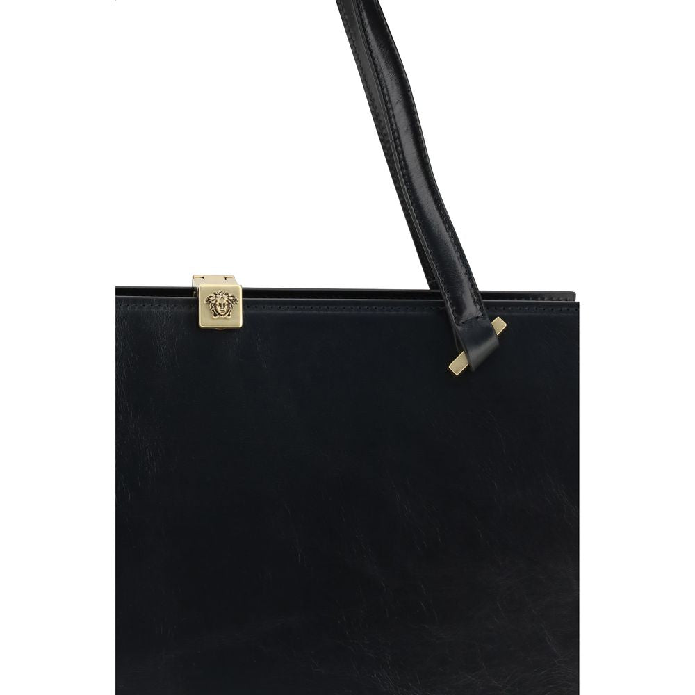 Discover the Versace Black Calf Leather Bos Taurus Shoulder Bag, a masterpiece of luxury craftsmanship that embodies elegance and sophistication for the discerning individual.