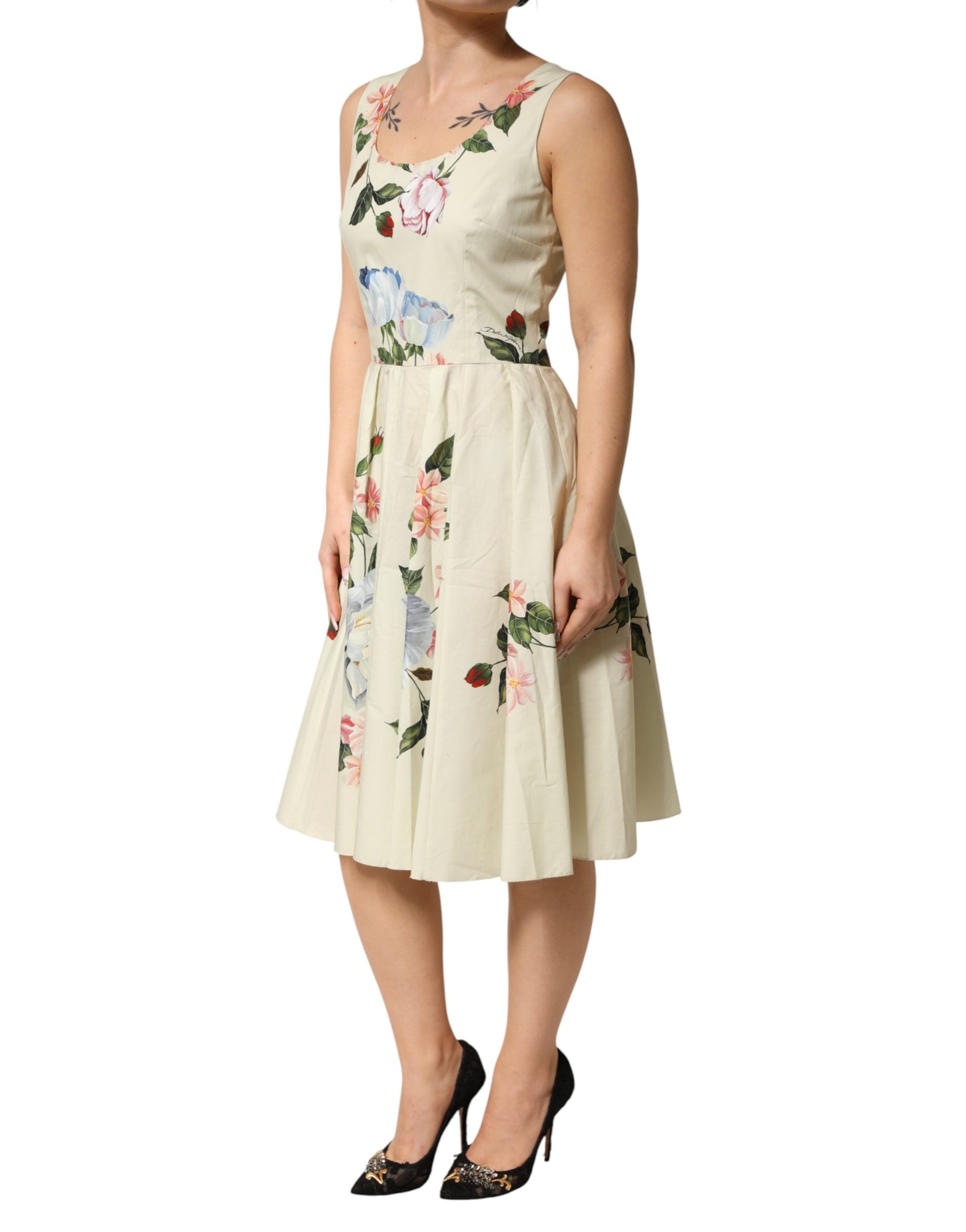Indulge in the elegance of the Dolce & Gabbana Beige Floral Sleeveless A-line Midi Dress, crafted from luxurious cotton for a refined silhouette that embodies sophistication and allure.