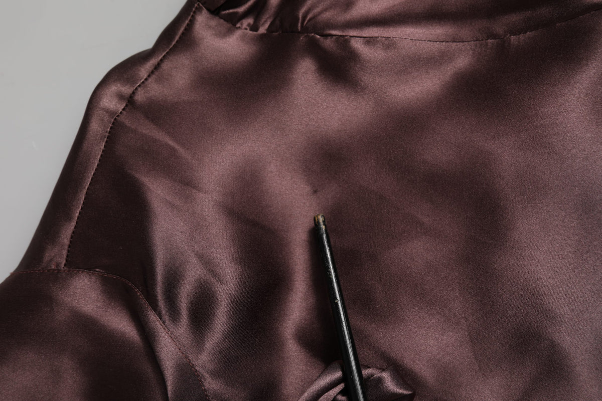Indulge in the exquisite allure of Dolce & Gabbana's Violet Satin Long Sleeve Ascot Tie Shirt, a masterpiece of Italian craftsmanship that elevates your elegance for any occasion.