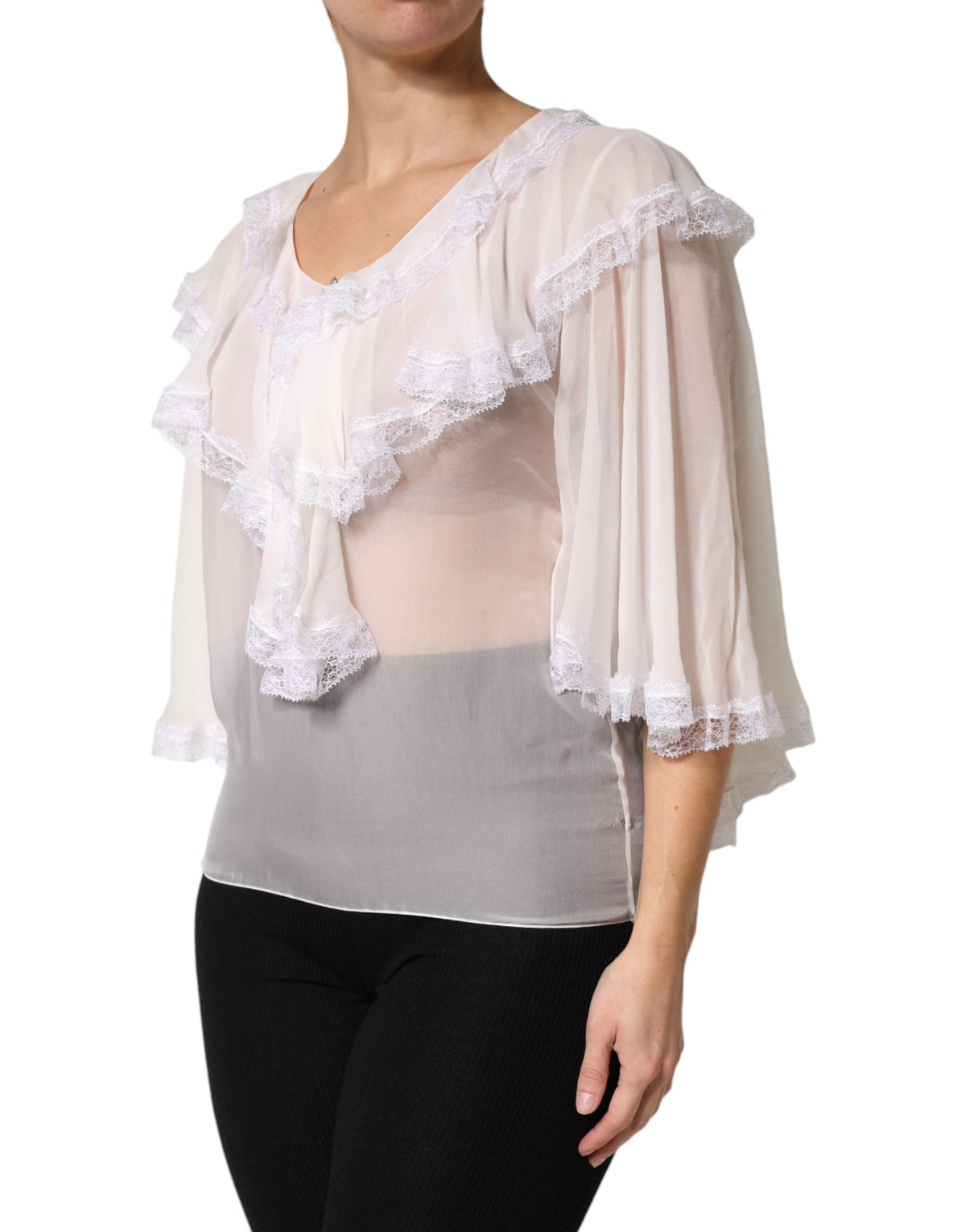 Elevate your wardrobe with the Dolce & Gabbana White LongSleeve Lace Trim Ruffled Blouse, a luxurious blend of silk and lace that embodies timeless elegance and sophisticated allure.