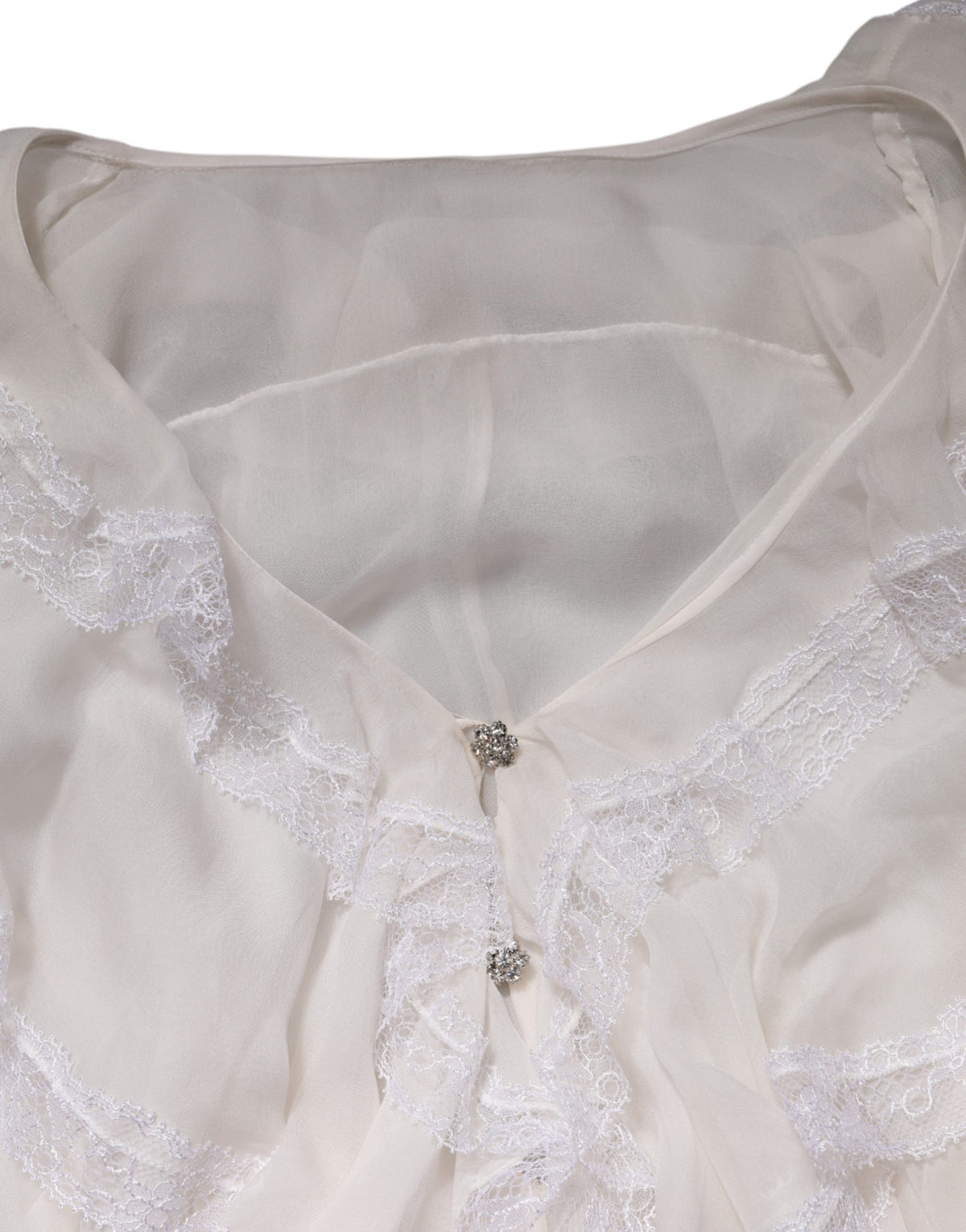 Elevate your wardrobe with the Dolce & Gabbana White LongSleeve Lace Trim Ruffled Blouse, a masterpiece of Italian craftsmanship in luxurious silk, perfect for any refined occasion.