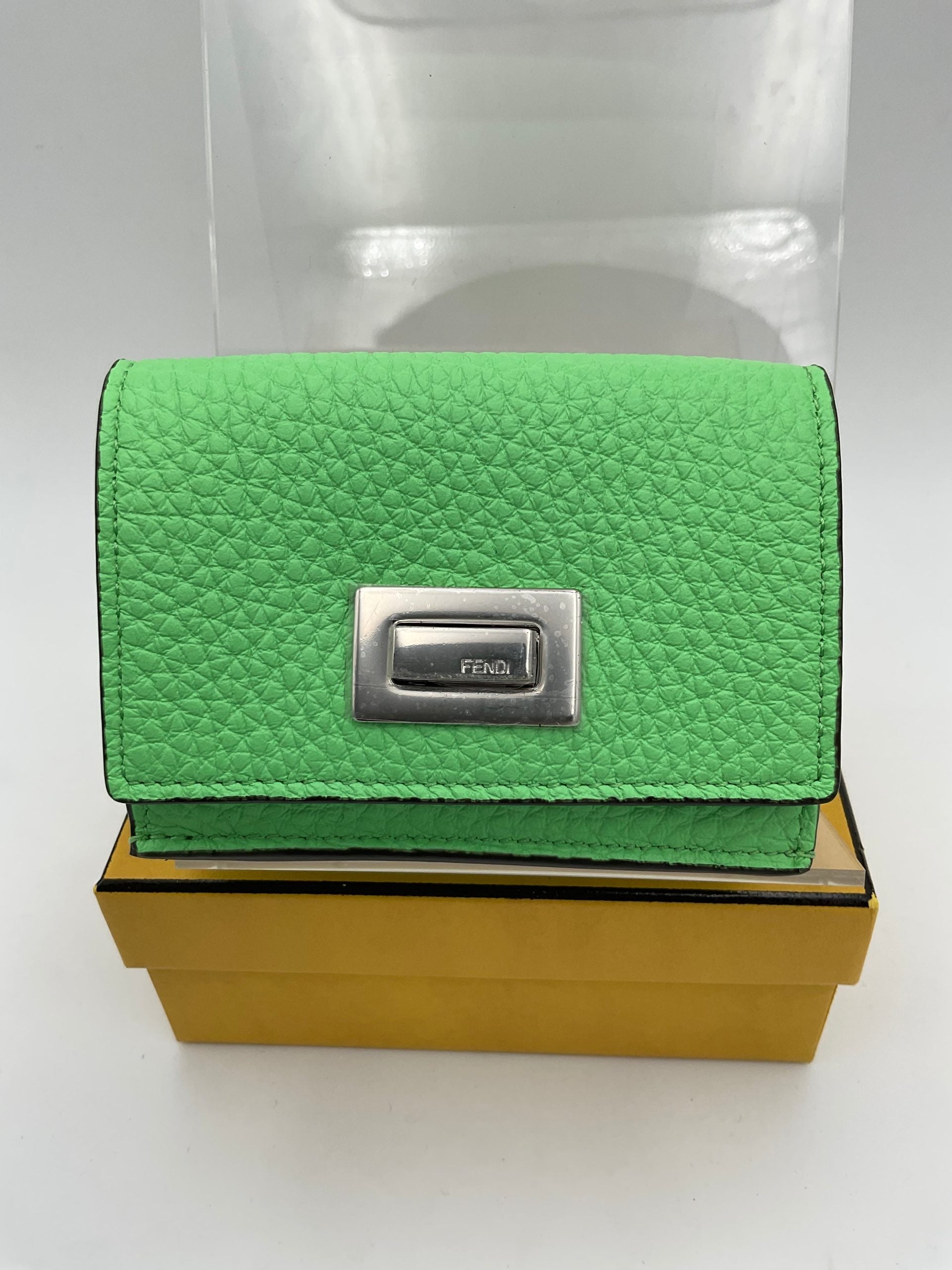 Discover the Fendi PEEKABOO Small Wallet, a masterpiece of Roman and calf leather, embodying timeless elegance and sophisticated artistry for discerning individuals.