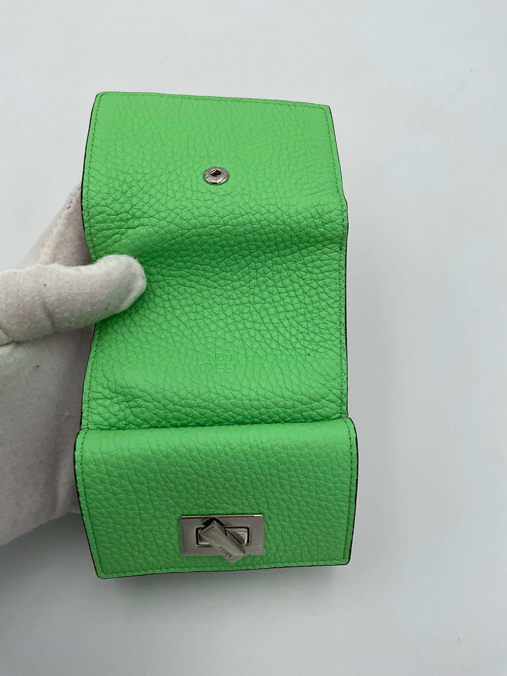 Discover the Fendi PEEKABOO Small Wallet, a masterpiece of Roman and calf leather, embodying luxury and sophistication for those who appreciate timeless elegance.