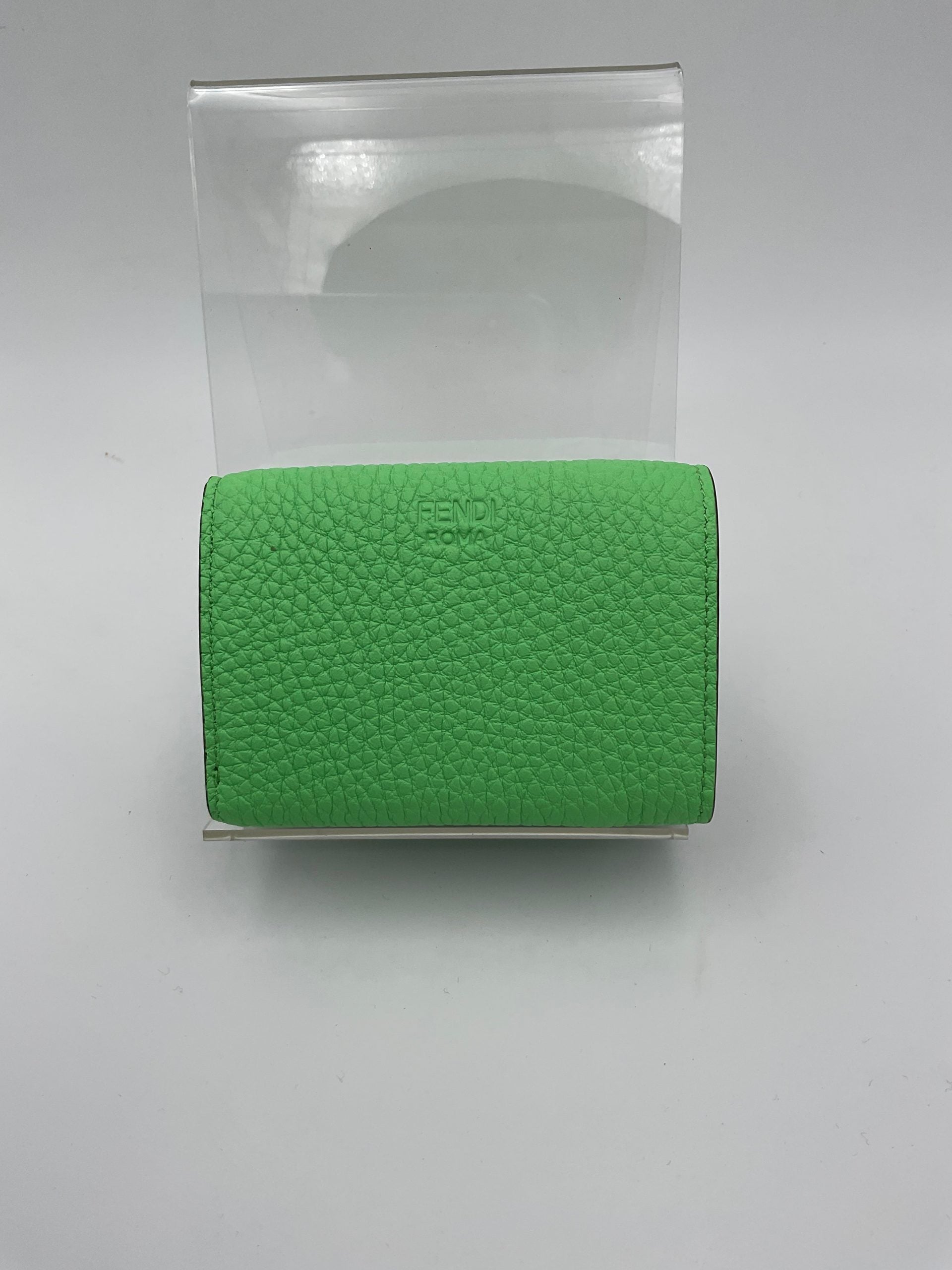 Indulge in the Fendi PEEKABOO Small Wallet, a masterpiece of Roman and calf leather, blending exquisite craftsmanship with timeless luxury for the discerning connoisseur.