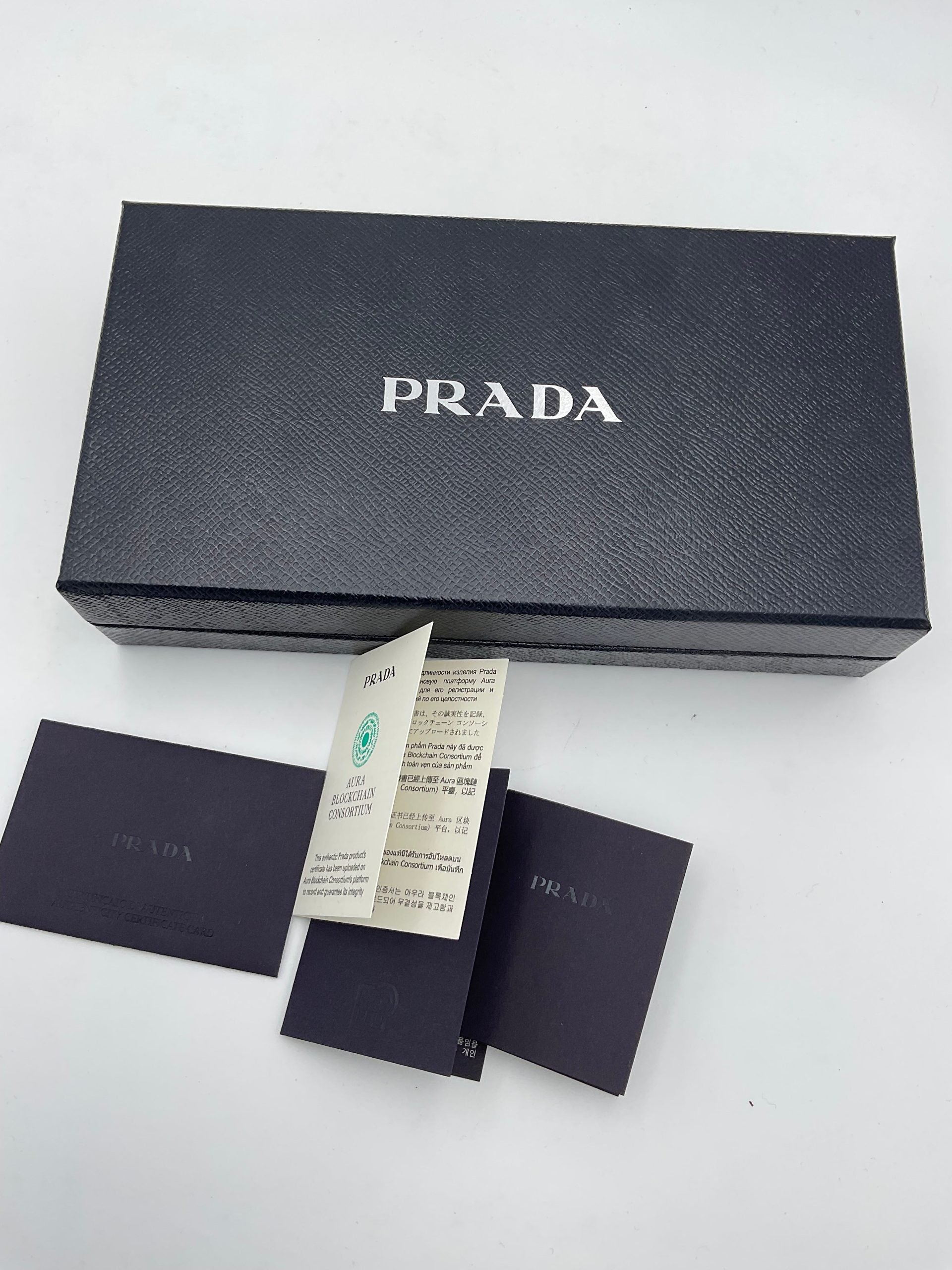 Discover the Prada PRADA Powder Saffiano Wallet, a symbol of luxury and sophistication, featuring exquisite craftsmanship and a chic card holder for the discerning individual.